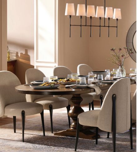 Ready for your fall dining room refresh or go wow your family and friends for the coming holiday gatherings? We are in love with this Tuscany inspired dining room by Arhaus. The room features a extendable solid wood dining table  with an mod World charm. The chandelier above is Midcentury Modern inspired  with a warm and elegant vibe while the dining chairs , crafted by Italian artisans, have a luxurious look. A hand-knotted viscose rug anchors  space with the intricate design pattern. #diningroom 

#LTKSeasonal #LTKHoliday #LTKhome
