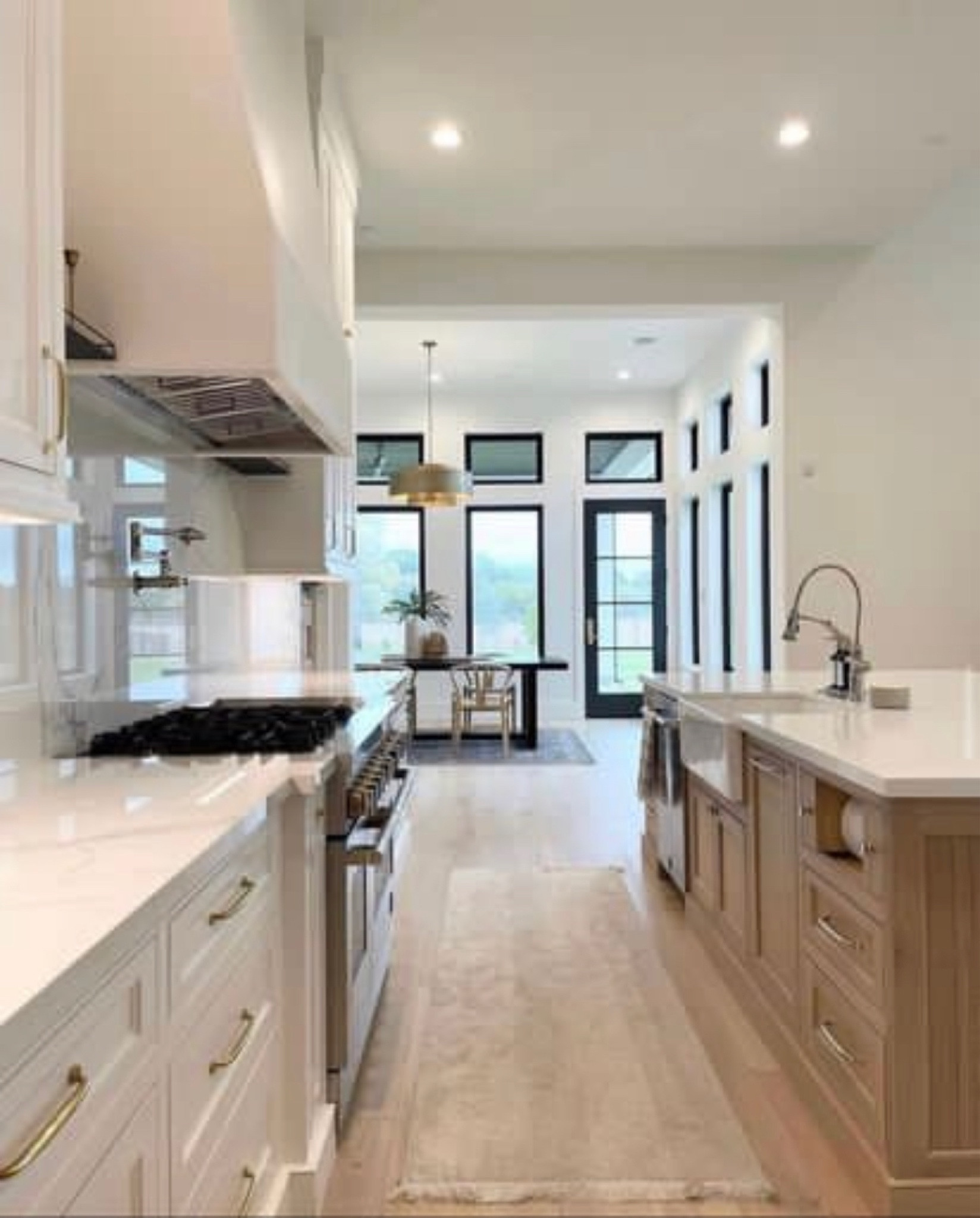 Kitchen inspiration.  Wirral modern classic kitchen. Neutral home design. Brass cabinet hardware. Washable rugs. Dining room lighting. 

#kellerandoak #neutralhome #ltkhome #rejuvenation #interiordesign 