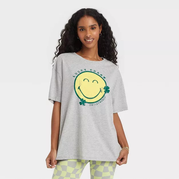 Women's St. Patrick's Day Shamrock SmileyWorld Short Sleeve Oversized Graphic T-Shirt - Gray | Target
