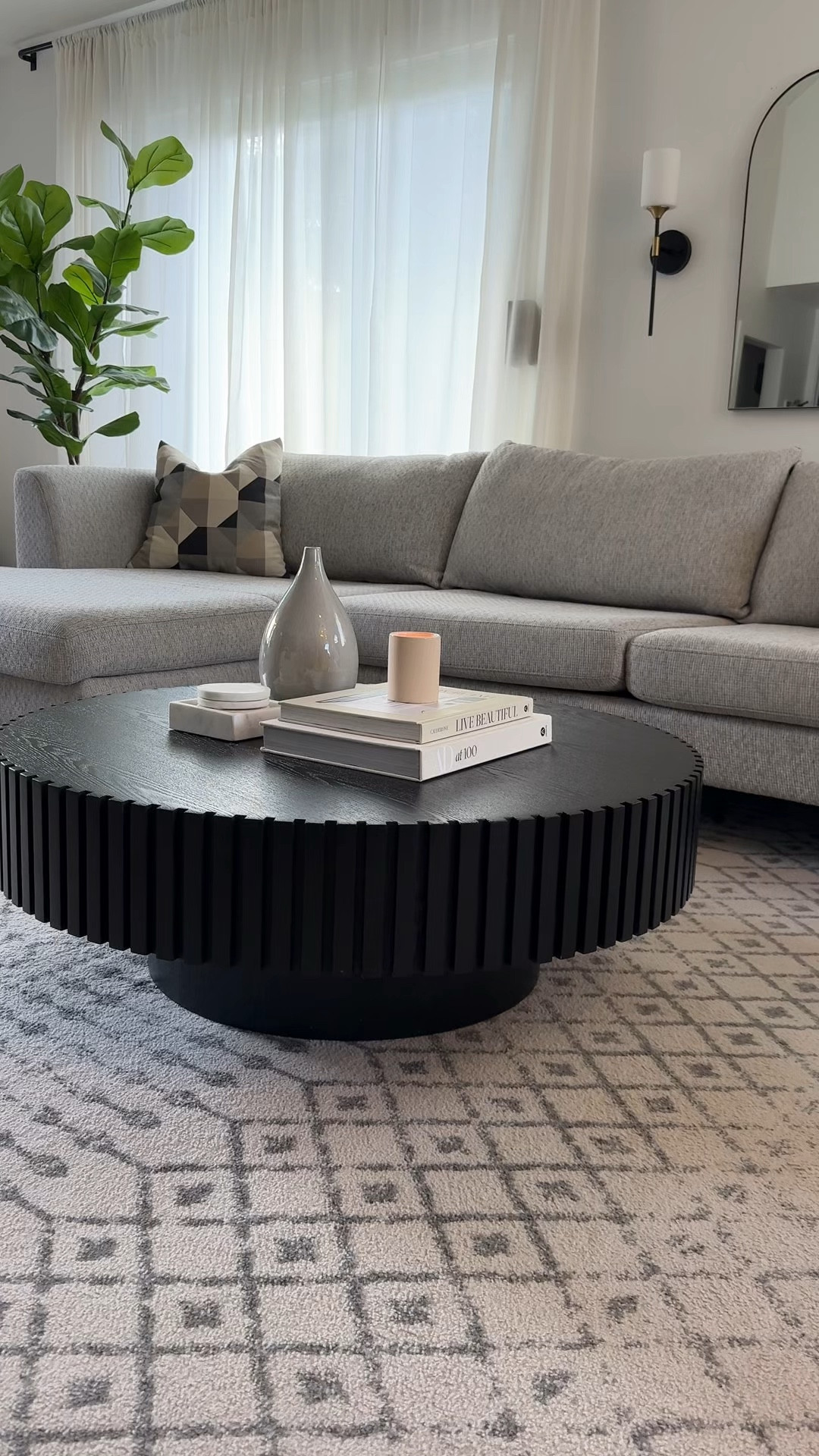 Living room details 🖤✨

Modern organic decor, coffee table, black coffee table, round coffee table, sectional couch, grey couch, living room design, living room area rug, amazon home, designer or dupe, save vs splurge 

#LTKHome