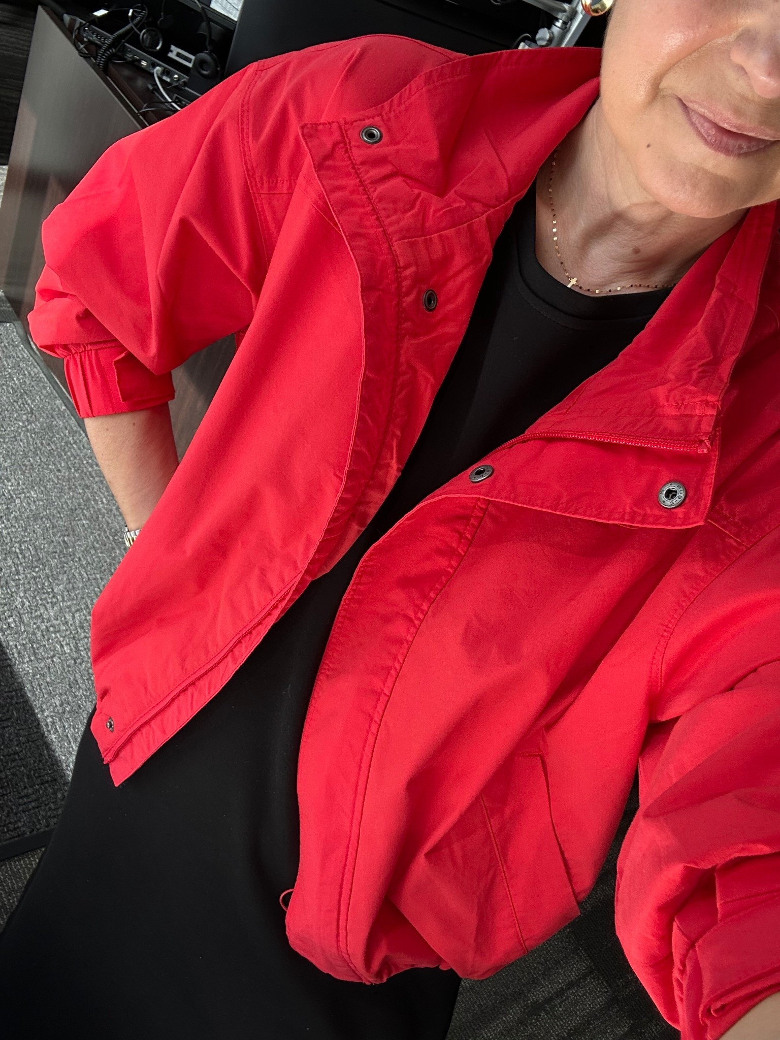 Old Navy Red Windbreaker - wearing a size small. It runs TTS! Fully lined, pockets, drawstring to cinch around waist. It’s SO nice!!! It’s a cotton poplin blend with nylon so it’s very soft! 