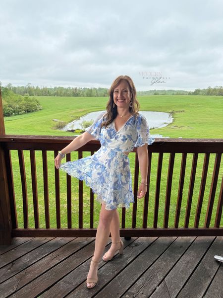 Spring wedding guest dress Modern Farmhouse Glam. I’m wearing a size medium, sized up. I also pinned the top bc it was too low. Flowy and comfortable  Back of dress is so cute! 

Flowy floral dress, blue and white, brunch dress baby shower summer short mini. Heels shoes tan dsw lipstick 

#LTKStyleTip #LTKShoeCrush #LTKWedding