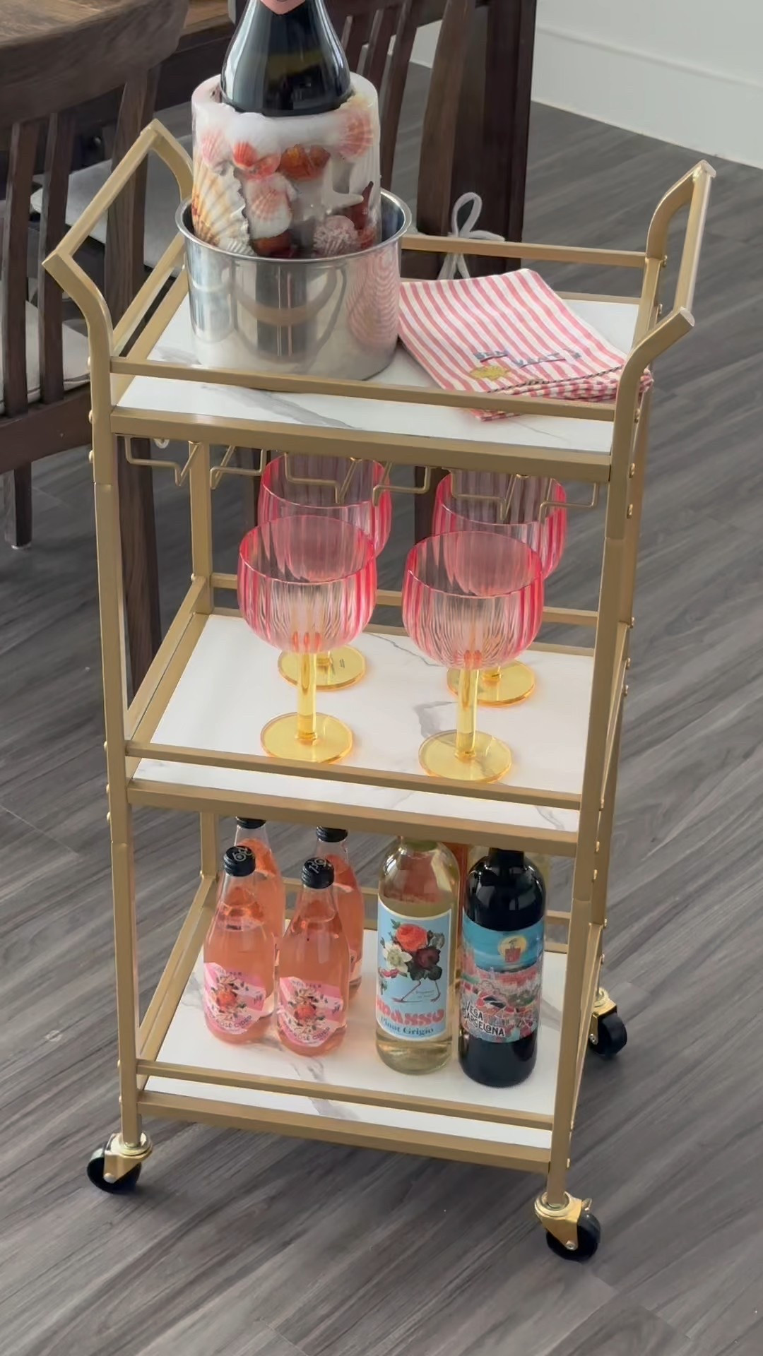 I LOVE this bar cart!! It does come in a larger size but I love this one because I can easily tuck it away in a closet if needed. It has a spot to hang glasses that’s optional as well! 
We are ready to enjoy the long Summer nights ahead! 🥂

#LTKSummerEdit #LTKHome