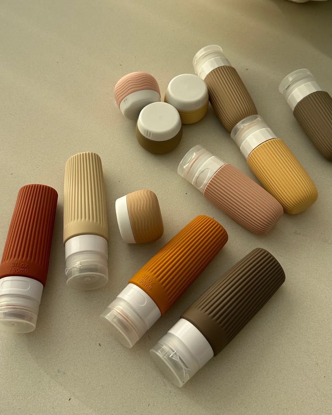 I categorically do not travel without some combination of these travel tubes in my beauty bag (I can’t find the exact ones I bought because I’ve had them for years, but these* or these* look very similar). I use them to decant my larger toiletries - cleansers, body oils, shower gels, shampoos - into smaller, lighter vessels.

#LTKbeauty #LTKtravel #LTKhome