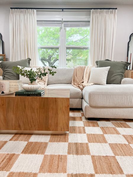 Living room sources including checker rug, coffee table, curtains 

#LTKhome #LTKstyletip #LTKFind