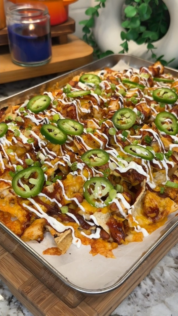 bbq chicken nachos are a top tier summer meal! layered to perfection with juicy chicken, smoky barbeque sauce and lots of cheese- every bite will have you coming back for more🍗🧀✨

#kitchenfavorites #cookingessentials #bestcookware #favoritekitchenitems

Ingredients:
- 1 lb chicken breast
- 1 tbsp olive oil
- 1 tsp salt
- 1 tsp black pepper
- 1 tsp paprika
- 1 tsp chili powder
- 2 tsp onion powder
- 2 tsp garlic powder
- 1.5 cups bbq sauce (use 1/4 cup to brush on the chicken)
- 8 oz sweet canned corn, drained & rinsed
- 8 oz pinto beans, drained and rinsed
- tortilla chips
- 8 oz sharp cheddar cheese, freshly shredded
- 8 oz Colby jack cheese, freshly shredded
- green onions, chopped
- jalapeño, sliced
- drizzle sour cream (about 1/4 cup)

#LTKHome #LTKSeasonal #LTKFamily