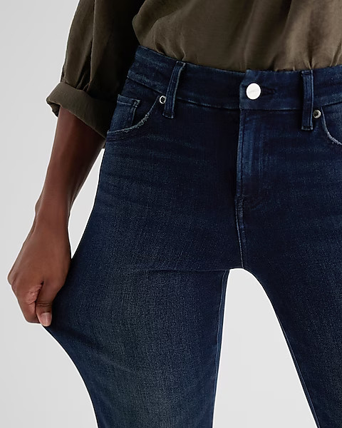 Mid Rise Dark Wash Raw Hem FlexX '70s Flare Jeans | Express