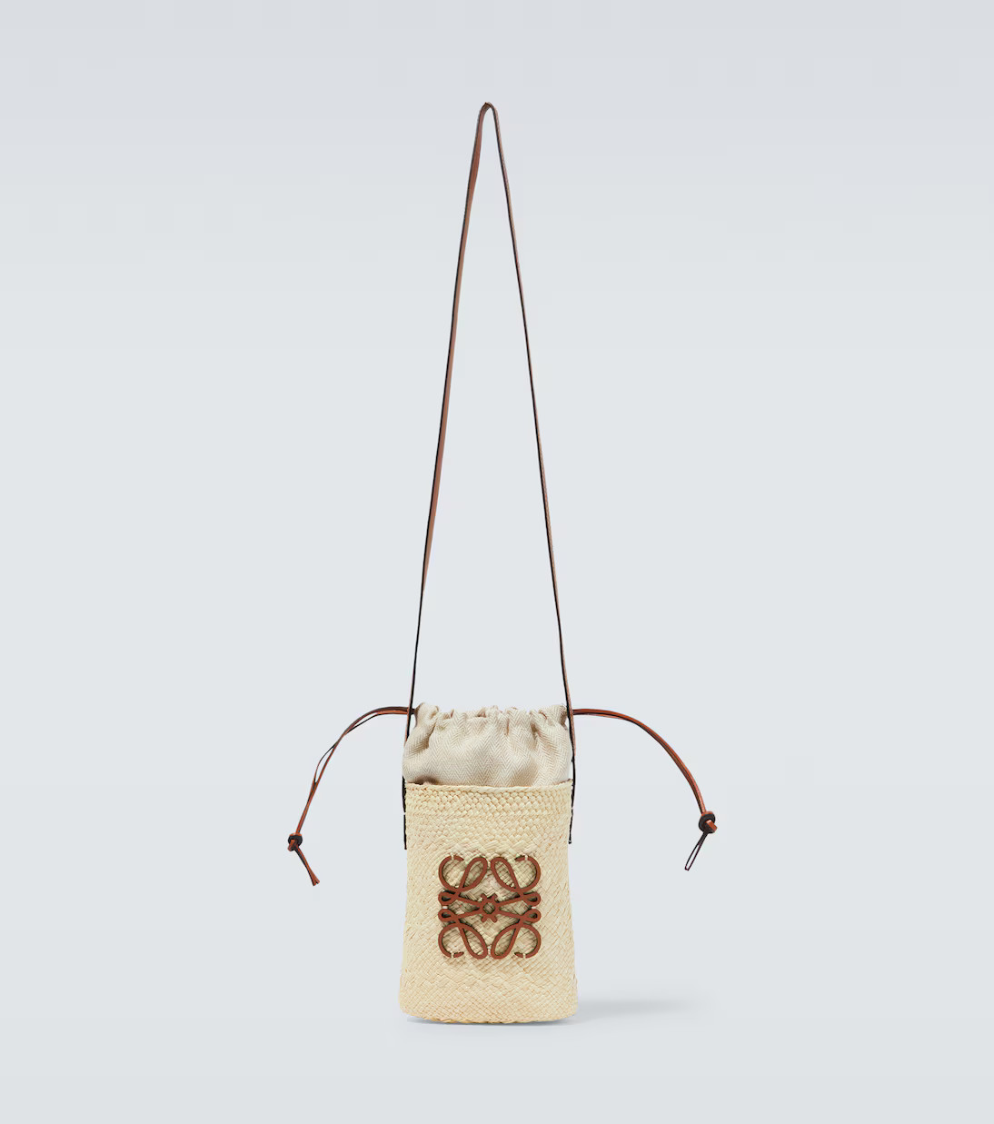 Paula's Ibiza Anagram woven bucket bag | Mytheresa (US/CA)