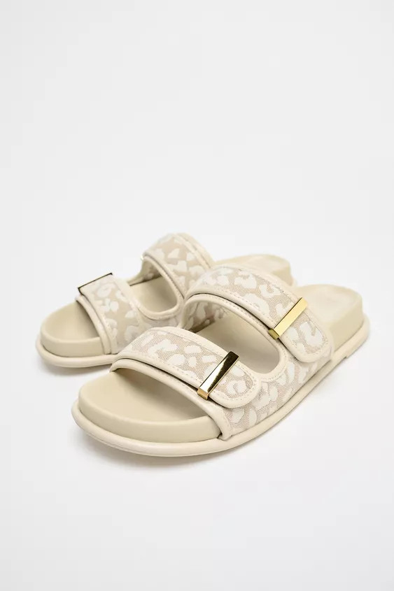Flat sandals. Double printed straps with metal appliqués and hook-and-loop fastening at the fron... | Zara US