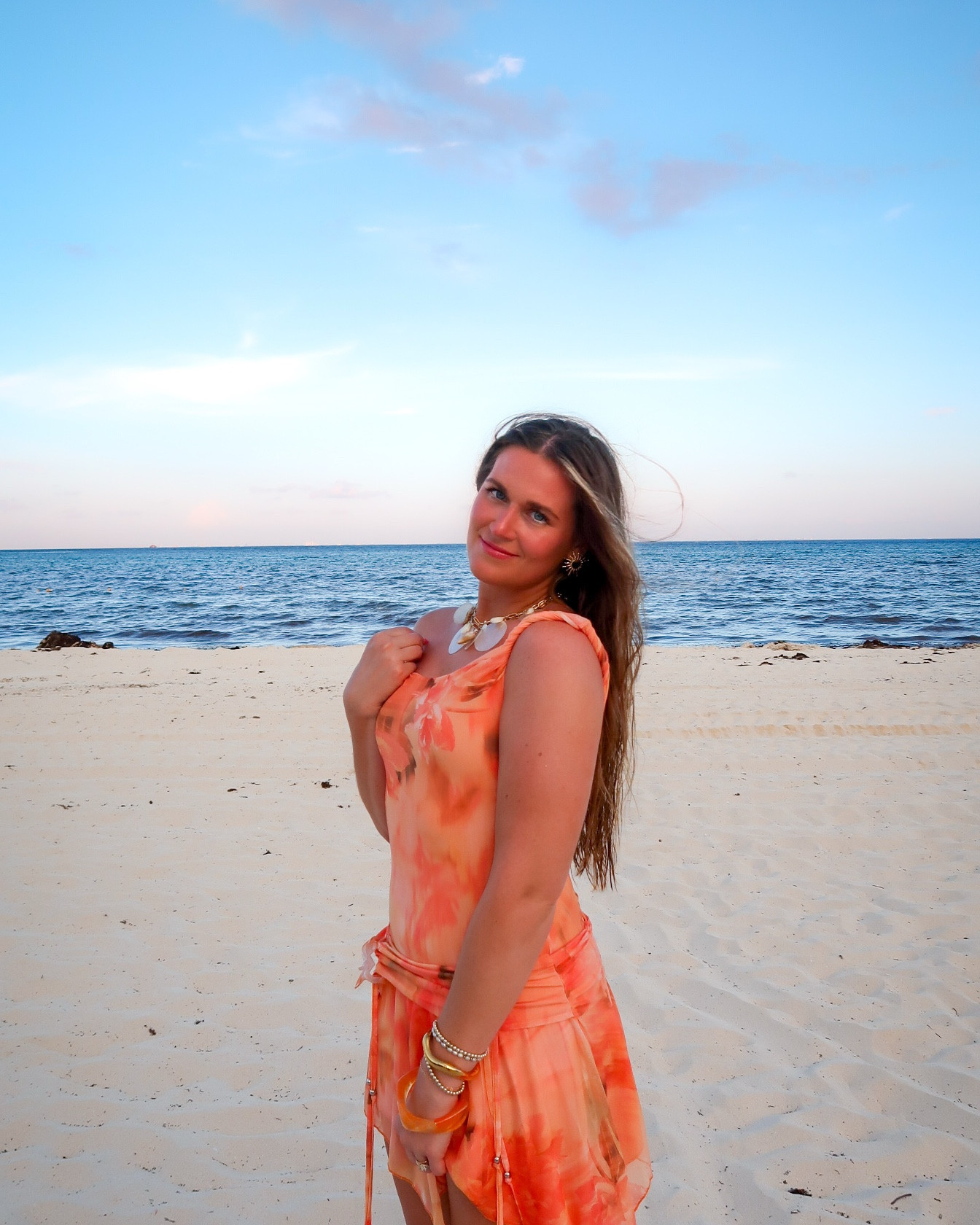 the perfect vacation dress for a holiday getaway!🌴🌺🍊 

#resortattire #mexico #summerdress #peppermayo #sunsetoutfit

#LTKStyleTip #LTKTravel #LTKMidsize