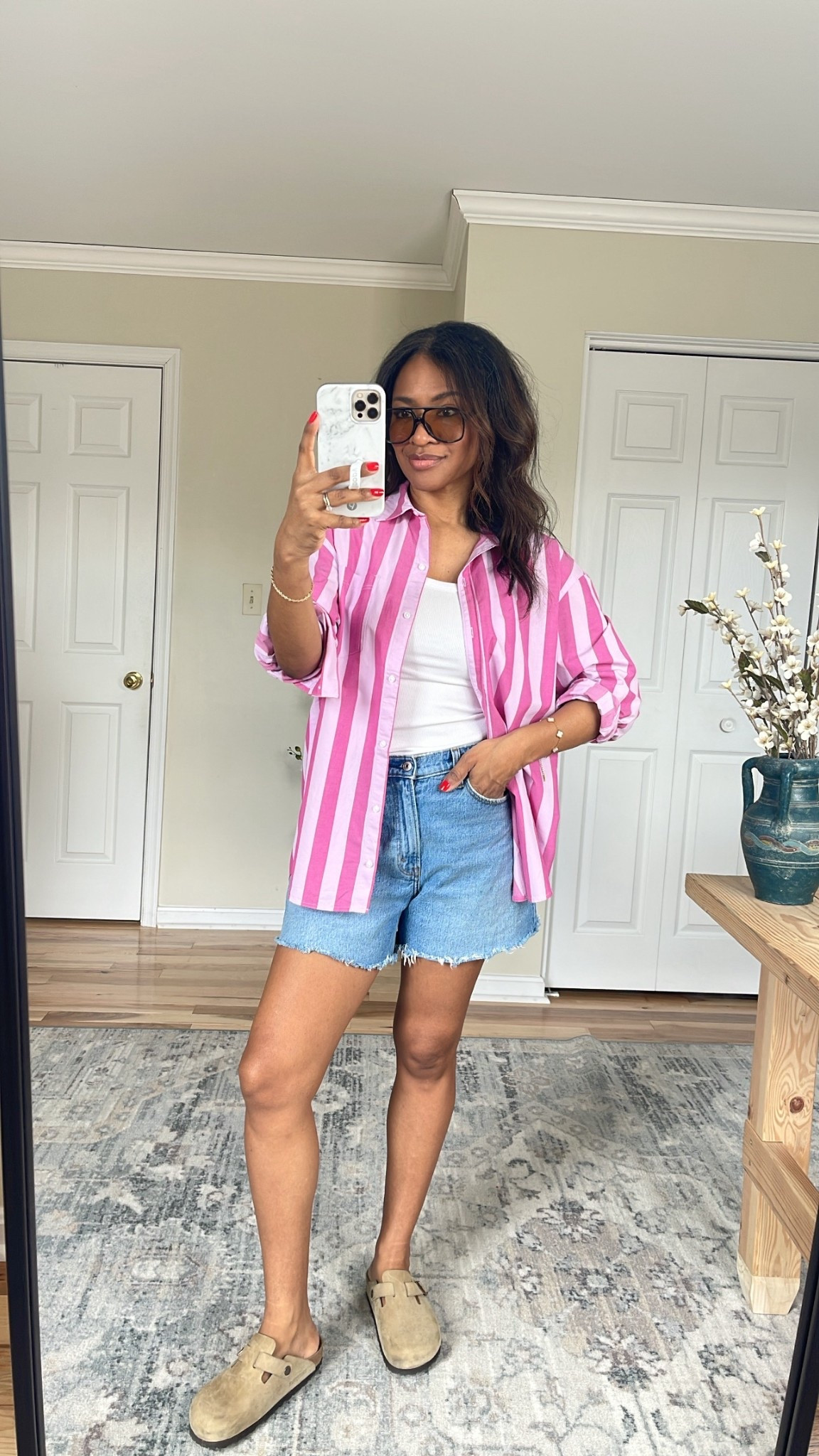50% off sale at Old Navy! I sized up to a medium in this button down striped shirt but a small probably would have worked a bit better since it’s already pretty oversized. Wearing a small in my Amazon tank top. Wearing a size 27 in the curve love denim Dad shorts. ￼

 #ltkgrwm #ltkootd #ltkover40