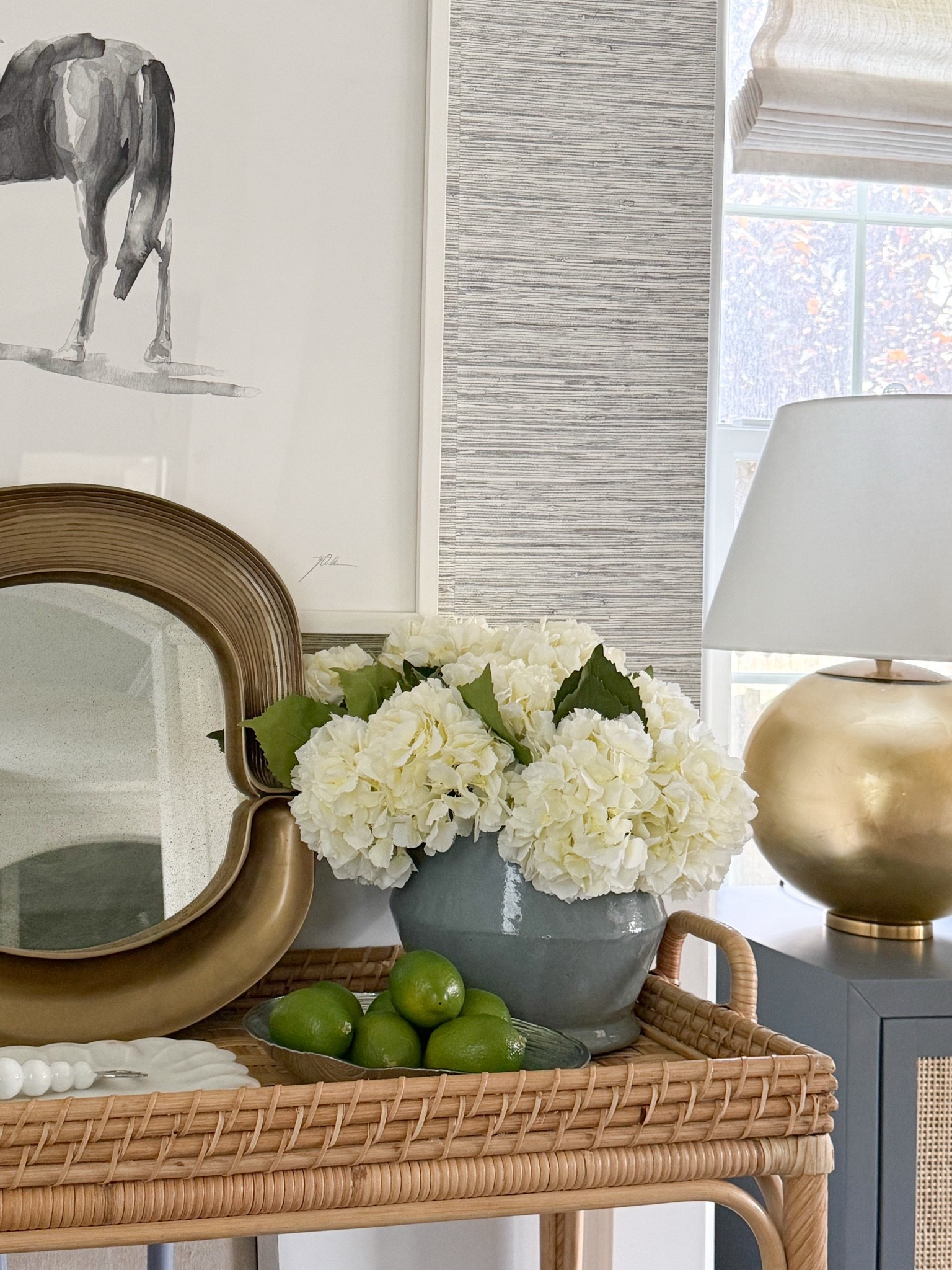 I found these gorgeous white hydrangea that come as a set of 12 stems! Split them up into smaller vases or pop them all into one like I have here. So pretty!

Dining room, chandelier, lighting, dining room inspo, dining room decor, console table decor, Serena & Lily, wallpaper, girlonthehudson, neutral home, modern coastal, minted art, cozy home