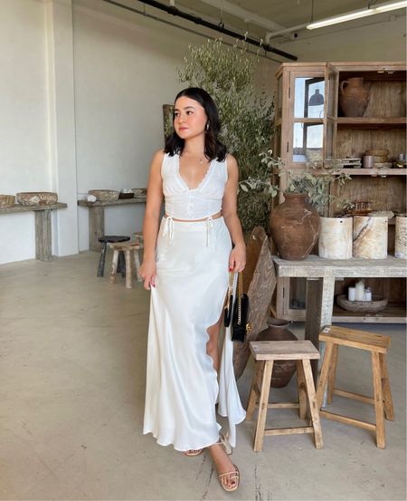 Neutral style outfit! This maxi skirt flows so beautifully and the crop top pairs well for an all white outfit. Also loving the strappy block heels and crossbody bag 🫶🏼

#LTKshoecrush #LTKstyletip #LTKitbag