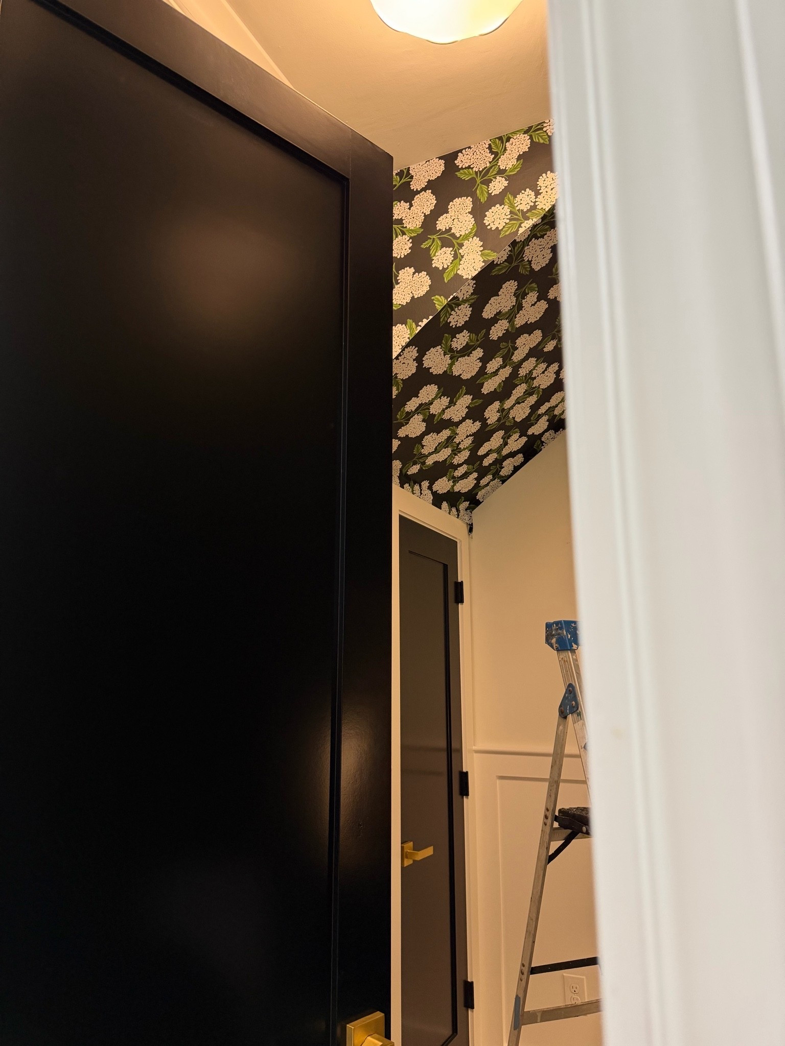 Sneak peek of our laundry room wallpaper!