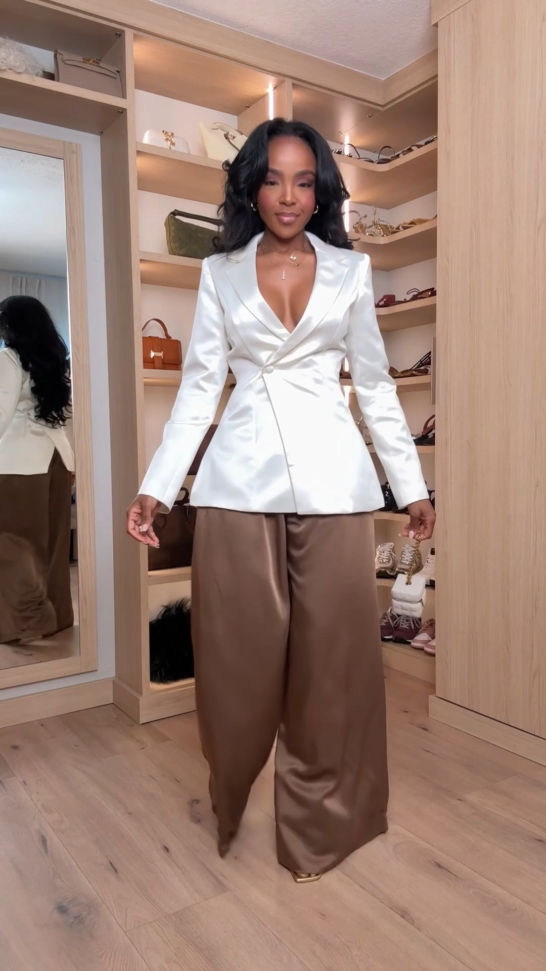 ✨ Elevated Neutrals with a Luxe Feel — a tailored satin blazer paired with fluid brown trousers for an effortlessly polished look. This is one of those outfits that instantly makes you feel put together without trying too hard.

Perfect for dinner dates, work events, holiday gatherings, or a chic night out. Styled multiple ways so the cost per wear keeps getting better — a true long-term shopping strategy piece.

📏 Sizing:
Blazer: Size Small  
Trousers: Size Small  
Height: 5'4" | Bust: 34D | Waist: 27" | Hips: 40"

Save this post to revisit later and shop the full look directly in the app.

This outfit blends classic tailoring, neutral tones, satin blazer styling, wide leg trousers, capsule wardrobe staples, elevated basics, and versatile outfit ideas for day to night wear.

Follow me on Instagram and YouTube @kirasfashionfinds