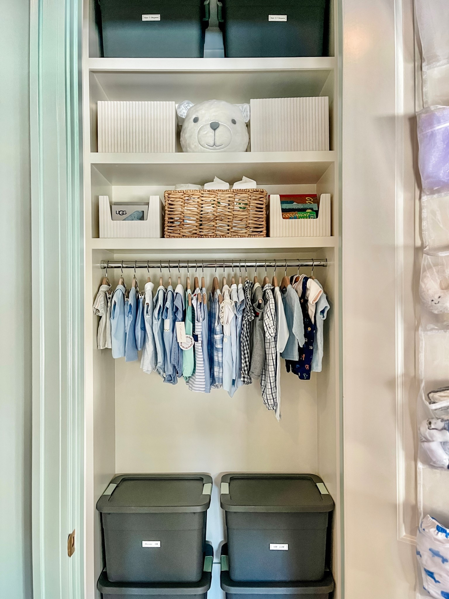 The sweetest little nursery came to life with the cutest bins and some room to grow.

Have y’all seen these white wooden bins from @target?? They are so modern and stylish and were the perfect addition for more storage in this closet.

We also added some labeled totes with clothing he has outgrown and clothing to grow into that is easy to access as he transitions into different sizes.