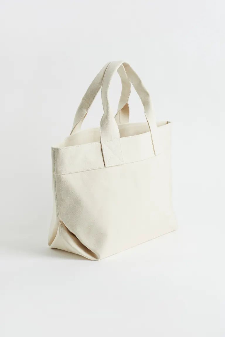 Shopper in thick cotton canvas. Two handles at top and an inner compartment with zipper. Lined. | H&M (US + CA)