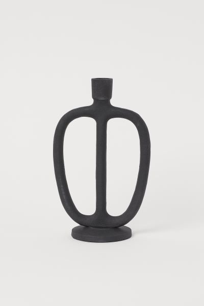 Tall, oval-shaped candlestick in matte metal with a low base. Height 9 1/2 in. Diameter at widest... | H&M (US)