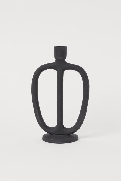 Tall, oval-shaped candlestick in matte metal with a low base. Height 9 1/2 in. Diameter at widest... | H&M (US + CA)