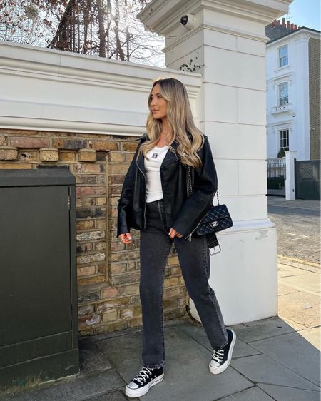 Simple and chic black and white look mixing high street and high end.  Levi’s washed denim dttaifhr leg jeans, black converse trainers, white Loewe tank top, new look faux leather jacket & Chanel flap bag. 

#LTKstyletip #LTKitbag #LTKshoecrush