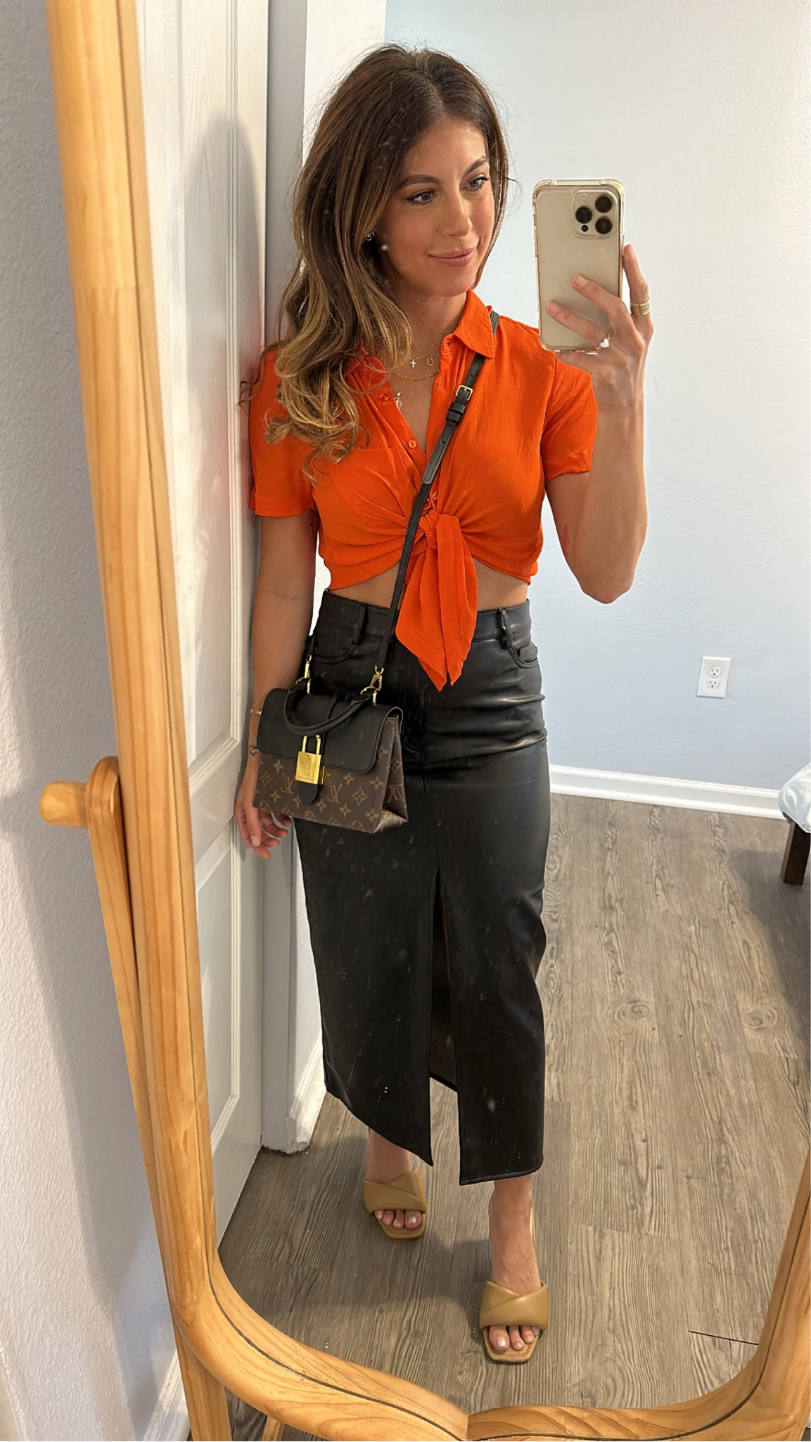 I’m loving neon paired with faux leather for a summer to prefall transition! I like tying button down shirts up high because of my short torso and petite frame. I always like to accentuate my waist and make it the smallest part of the r silhouette. These Steve Madden slide on kitten heels have been a hit. They’re comfortable enough to wear all day/night and are versatile enough to wear with almost anything! #neon #leatherskirt #midileatherskirt 

#LTKSeasonal #LTKSale #LTKFind