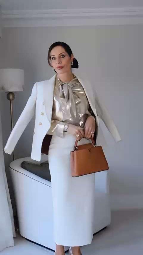 This look is all about contrast and structure — a statement Self-Portrait blouse paired with sharp white tailoring and elevated by refined accessories. The gold top is currently sold out, so I’ve linked the same blouse in black plus other chic alternatives that give the same luxe effect.

Finished with classic Dior accents, a timeless Louis Vuitton top-handle bag, and subtle details (the hair bow + earrings) that make the outfit feel intentional and polished.

I’ve linked exact pieces where available, along with similar and more budget-friendly options that work beautifully with this look.

Save this for elevated daytime or chic evening dressing 🤍

#LTKStyleTip #LTKLuxury #elevatedbasics #modernclassic #LTKWorkwear #wardrobebuilding #LTKFinds 

 #LTKdayinmylife #LTKgrwm #LTKootd