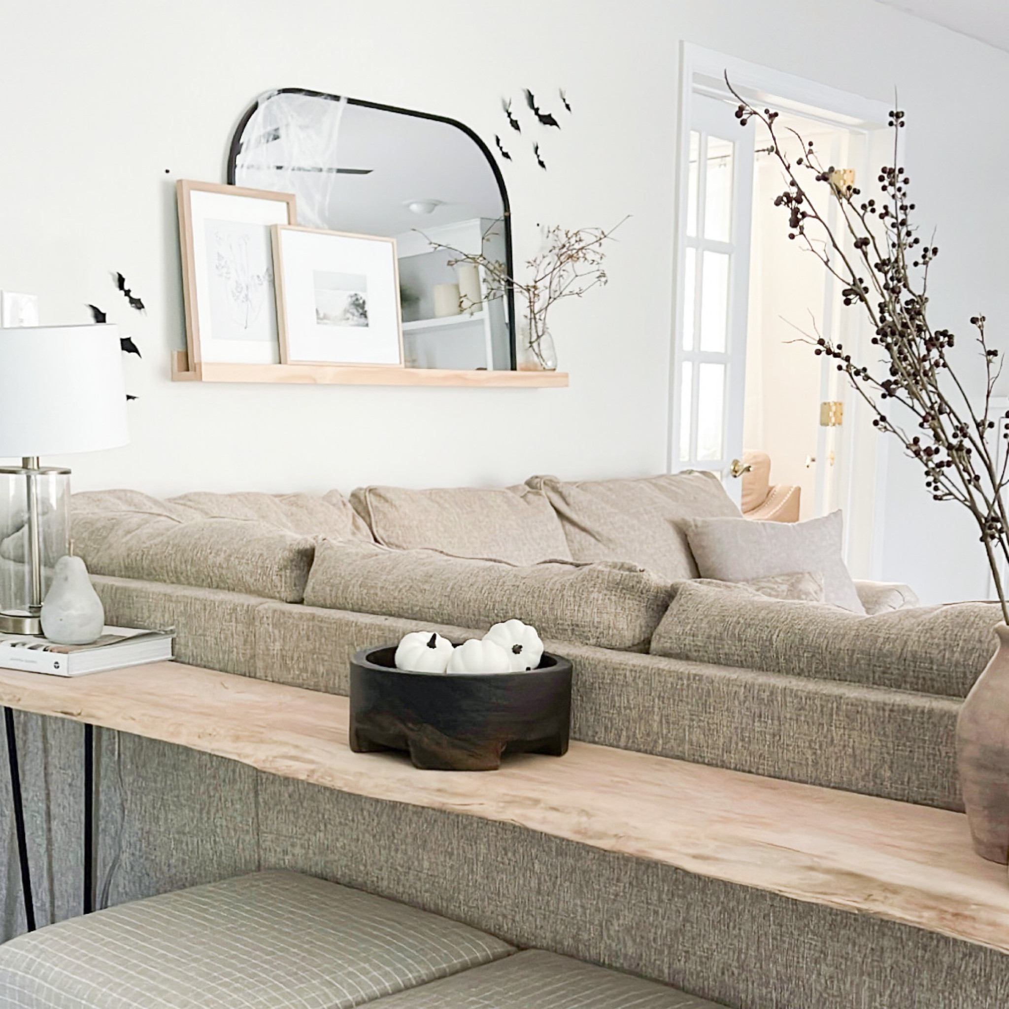 Incorporating small touches of Fall and Halloween decor from Target. Decorative wood bowl, white pumpkin decor, berry bundle and vase, black framed mirror, bats and some spider web netting.

#LTKsalealert #LTKstyletip #LTKSeasonal