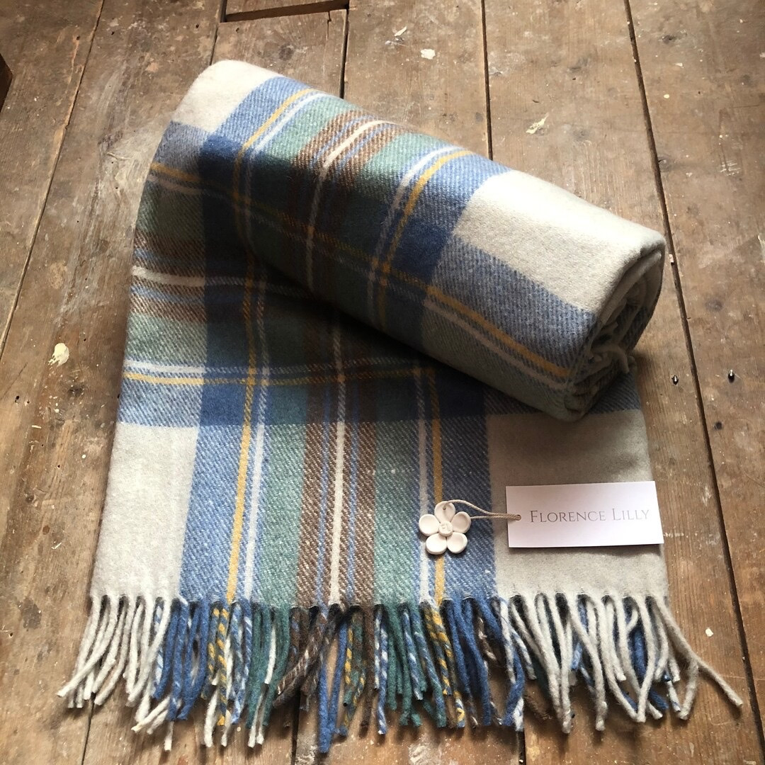Elevate your home with the FlorenceLilly Tartan Check Blanket/Throw, a stunning blend of style, comfort, and sustainability! The Stewart Muted Blue design features soft hues of pale blue, green, and cream, adding a touch of elegance to any room. Crafted from 70% recycled wool and 30% mixed fibers, this eco-friendly throw boasts incredible softness and a luxurious feel, perfect for everyday living. At 180cm x 150cm, it’s ideal for cozying up on the couch, layering on your bed, or adding charm to your décor. Plus, it’s machine washable and easy to care for!

#RecycledWoolThrow #EcoFriendlyLiving #TartanCheckBlanket #SustainableStyle #CozyHomeDecor #FlorenceLilly #HomeAccents #EtsyFinds

#LTKGiftGuide #LTKHome #LTKFindsUnder50
