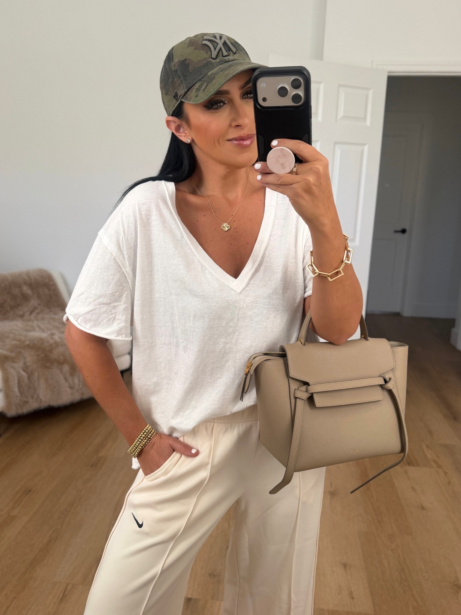 Nike Sportswear Women's Mid-Rise Wide-Leg Track Pants wearing size small. Free People Nina V-Neck Cotton T-Shirt wearing size XS