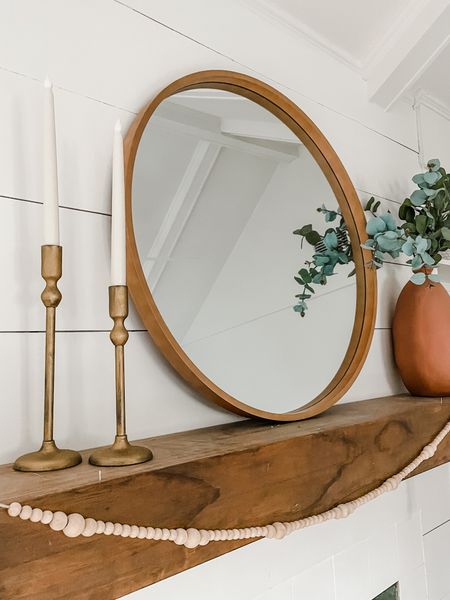 Simple mantle styling. Home decor doesn’t need to be cluttered. This round mirror with candles and greenery is enough. 

#LTKstyletip #LTKunder100 #LTKhome