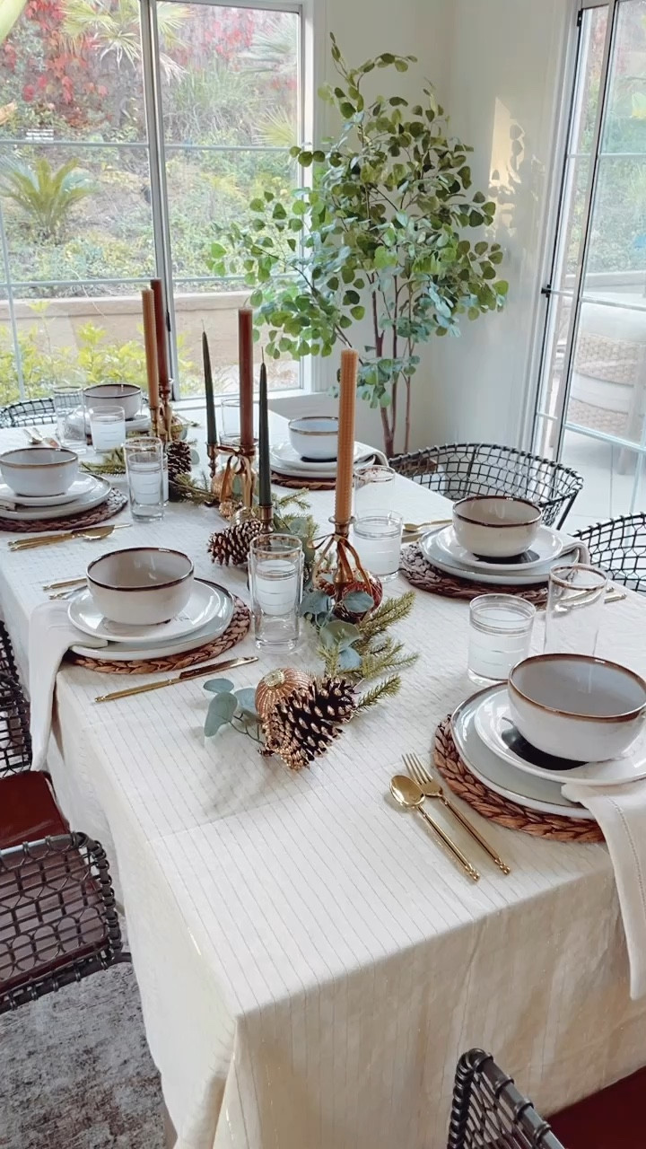 Holiday Tablescape details! Using a garland down the middle with candlesticks on either side. 

#LTKVideo #LTKHoliday #LTKHome