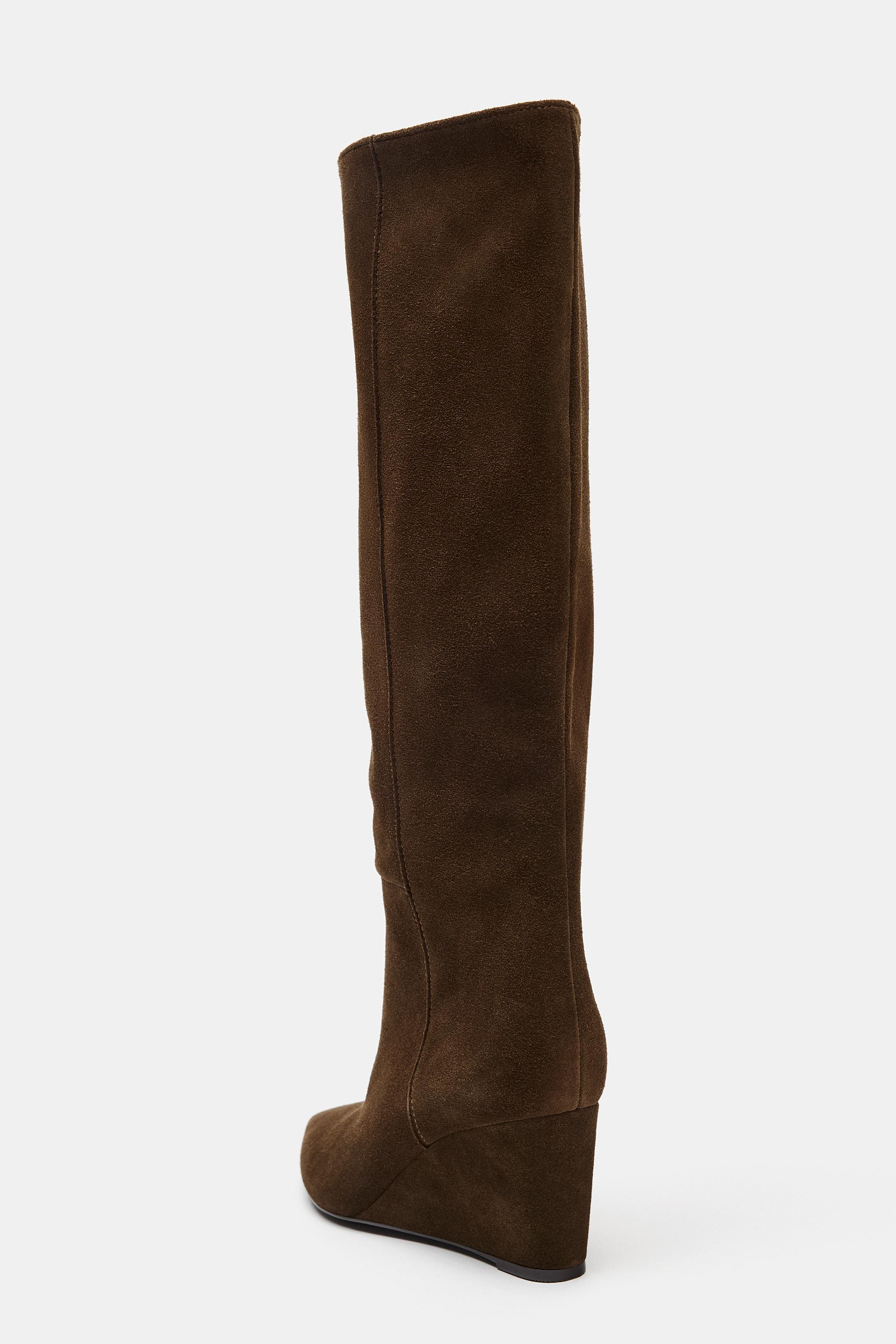 High-leg suede boot. Topstitching detail on the sides. Medium wedge heel. Easy pull-on style. Poi... | Zara US