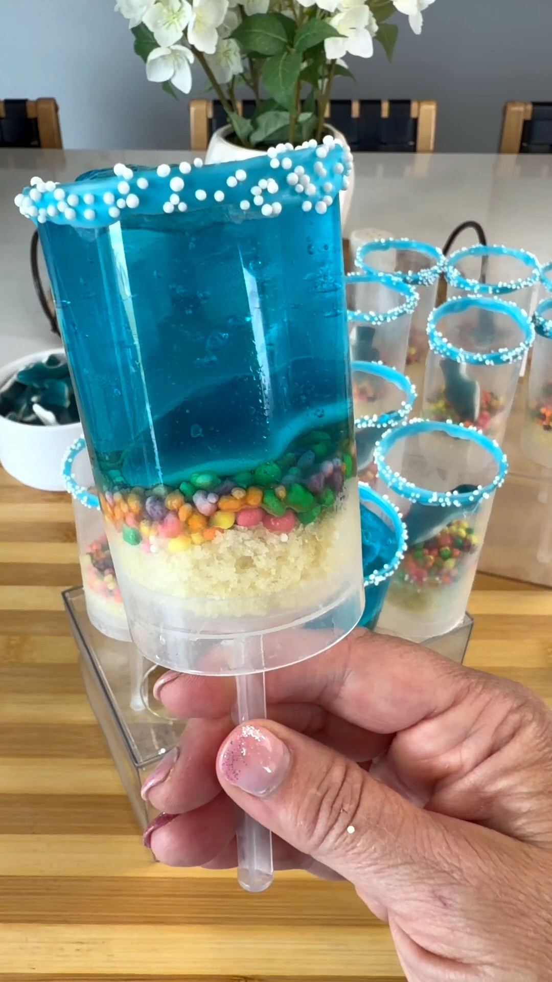 These shark jello push-up treats were about to humble me and almost complete fail 😂 I tried pouring the jello straight into the containers too early and let’s just say… blue slime everywhere.

Pro tip: let the jello set up first before adding it to the push-up containers! It makes layering SO much easier and keeps everything from turning into a melted mess.

We used pound cake for the “sand,” Nerds candy for the pebbles, gummy sharks, and finished them off with sprinkles around the rim for the cutest ocean-inspired treat.

10/10 cute once I stopped fighting the jello 😂

#LTKfoodie