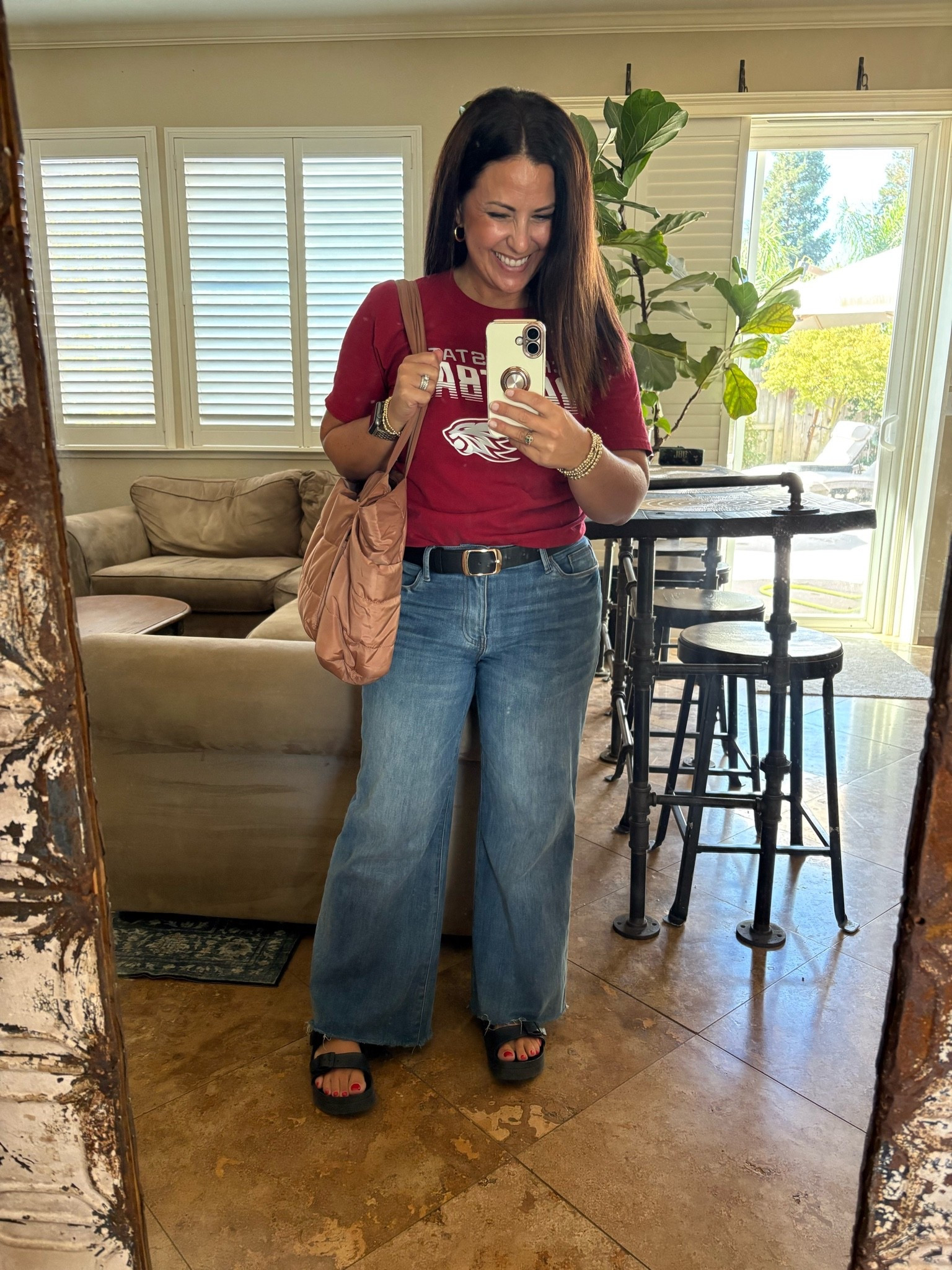 College T-Shirt Day 🎓❤️ A casual teacher outfit that still feels put together!

I paired my college tee with these high-rise wide-leg jeans, a classic black belt, comfy black platform sandals, and my everyday tote. This is the kind of easy business-casual teacher outfit I love for school days when I want to be comfortable but still look polished.

Perfect for teacher outfits, casual workwear, back-to-school outfits, college spirit days, wide-leg jeans outfits, and everyday fall outfit ideas.

#teacheroutfits #backtoschooloutfits #workwear #widelegjeans #casualoutfits

#LTKootd #LTKPetite #LTKWorkwear