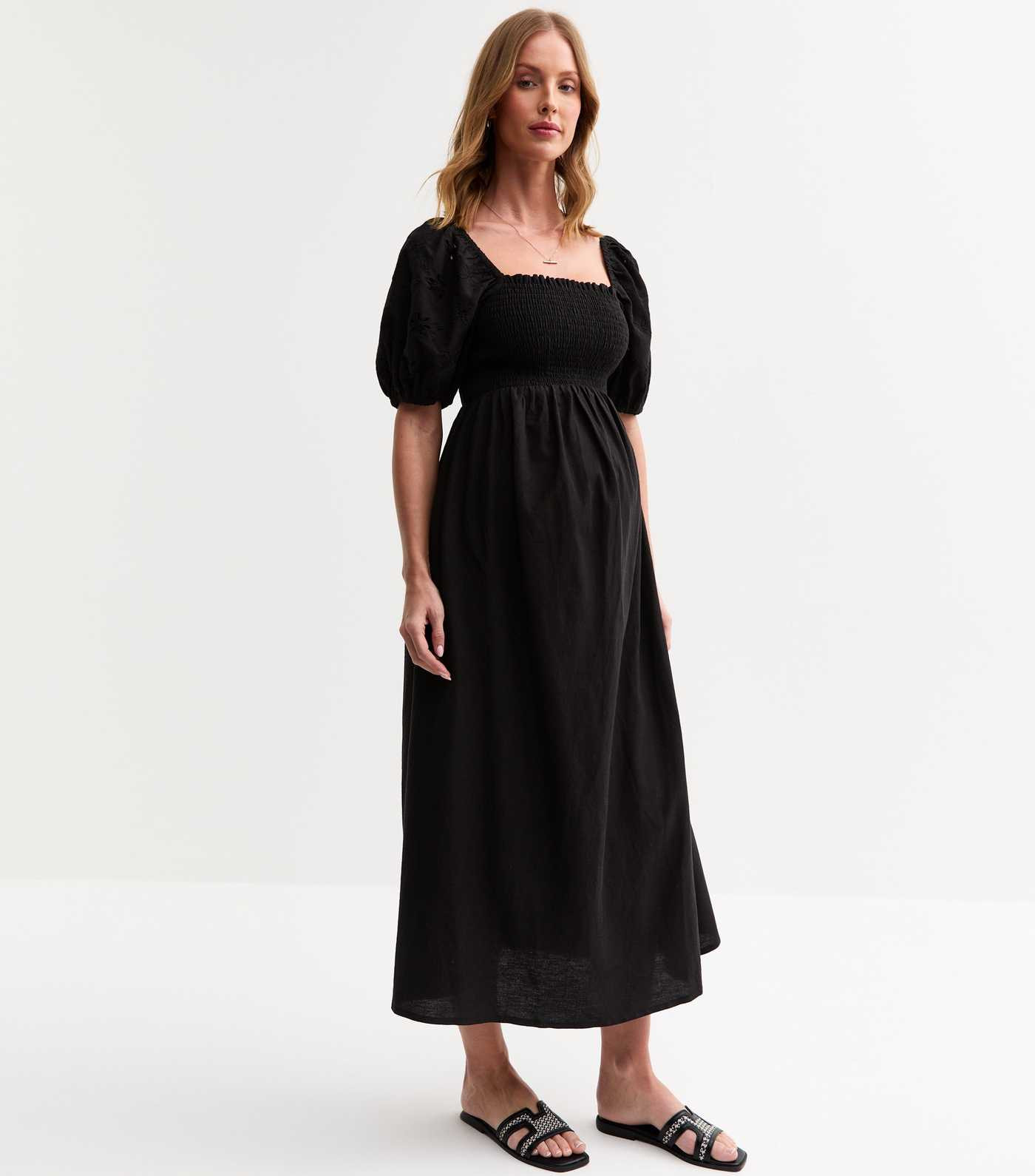 Maternity Black Floral Broderie Anglaise Puff Sleeve Midi Dress | New Look | New Look (UK)