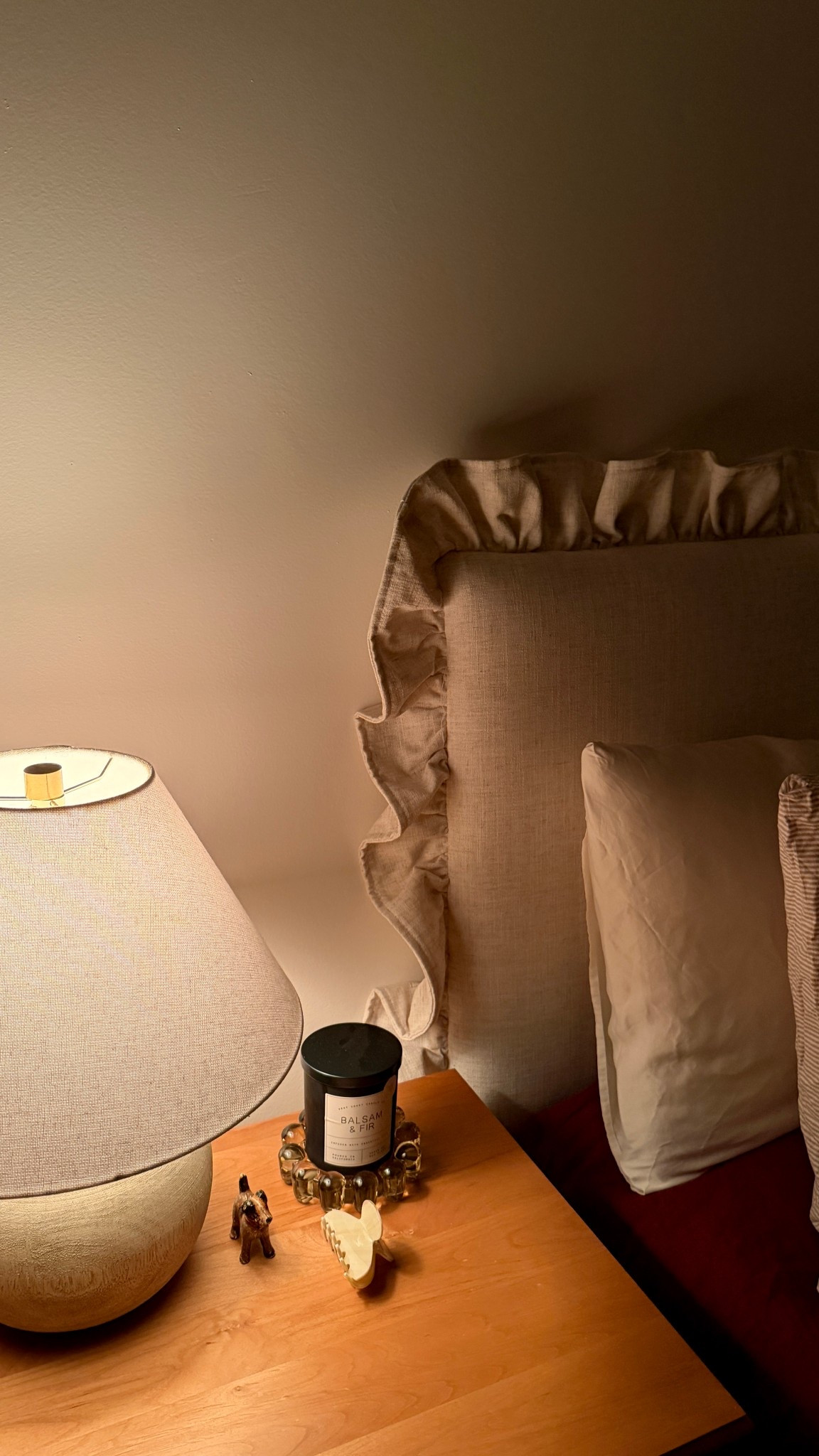 Cozy bedroom details ✨ our under $300 ruffle headboard is the latest addition to our room and I love how cozy it makes it! 

Use code HELLOHER20 to save on my bubble candle dish

#LTKHome #LTKSeasonal