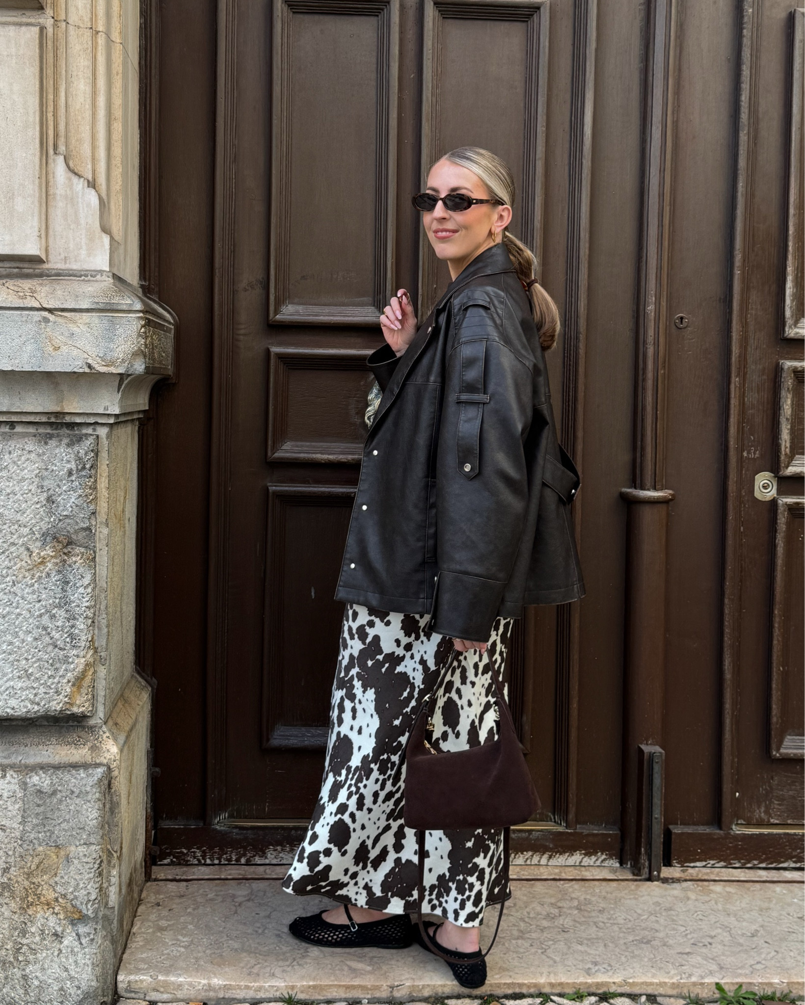 Cow print satin skirt outfit 🐄 

Leather jacket, spring trends, brown suede bag, cow print 

#LTKuk #LTKstyletip #LTKspring