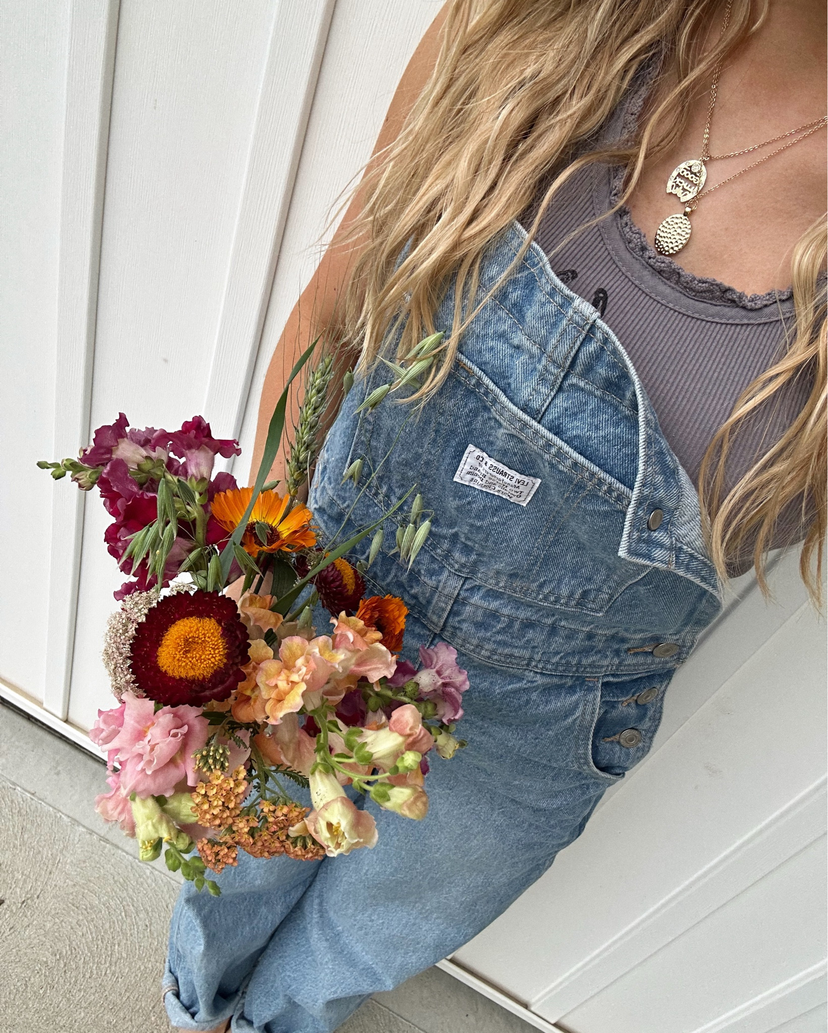 Denim Levi overalls + a handful of wildflowers — my favorite overalls for spring + summer 🍃💐🌻🌸🌼

living slow and sweet out here 🌾🌼 This look gives all the natural, country girl vibes. 

#LeviOveralls #CountryStyle #WildflowerPicking #NaturalBeauty #BumpFriendlyStyle #LifeOnLand #FarmgirlVibes #DenimDays #SlowLiving #WesternInspired #BohoWestern #CurlyHairAndOveralls #LTKfarmstyle #LTKcountry l

#LTKU #LTKSummerEdit #LTKSeasonal