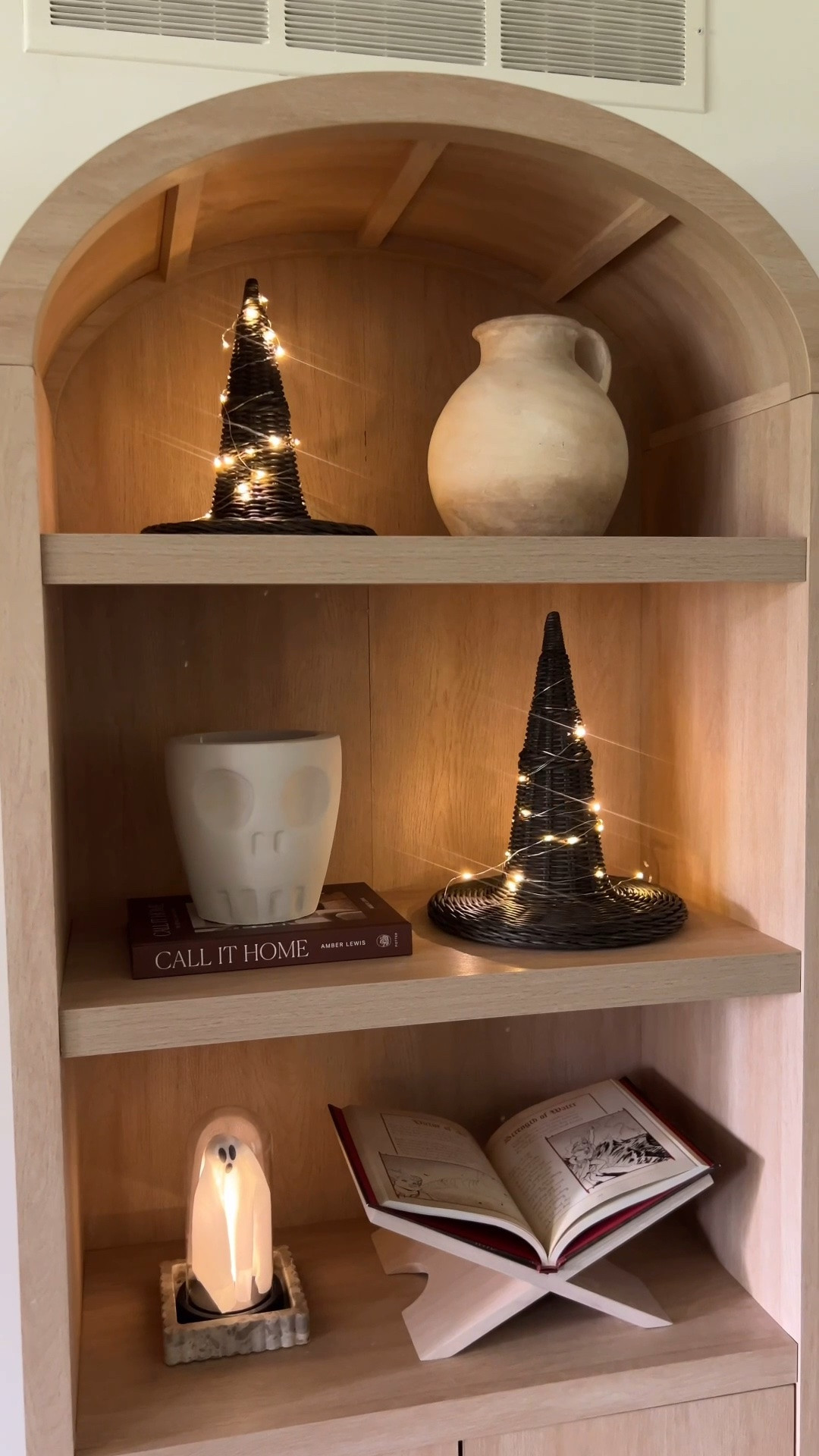 Halloween decor for my arched bookcase

#LTKHome #LTKSeasonal