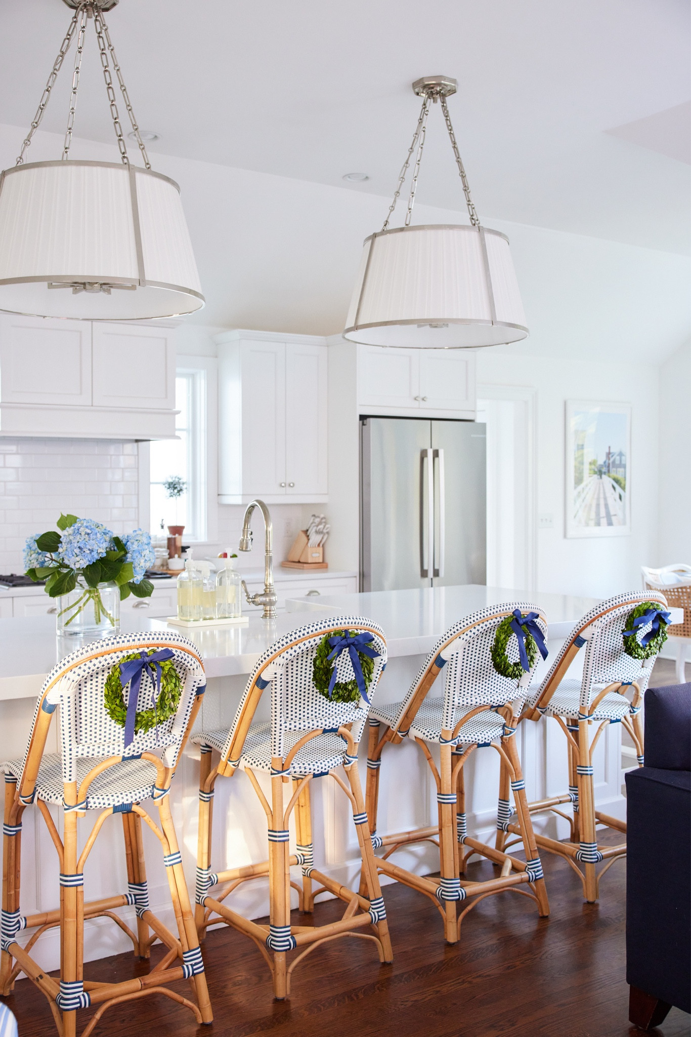 Mini boxwood wreaths on our Serena & Lily Riviera counter stools 💙 Counter stools and light fixtures on sale right now!

#LTKsalealert #LTKHoliday #LTKhome