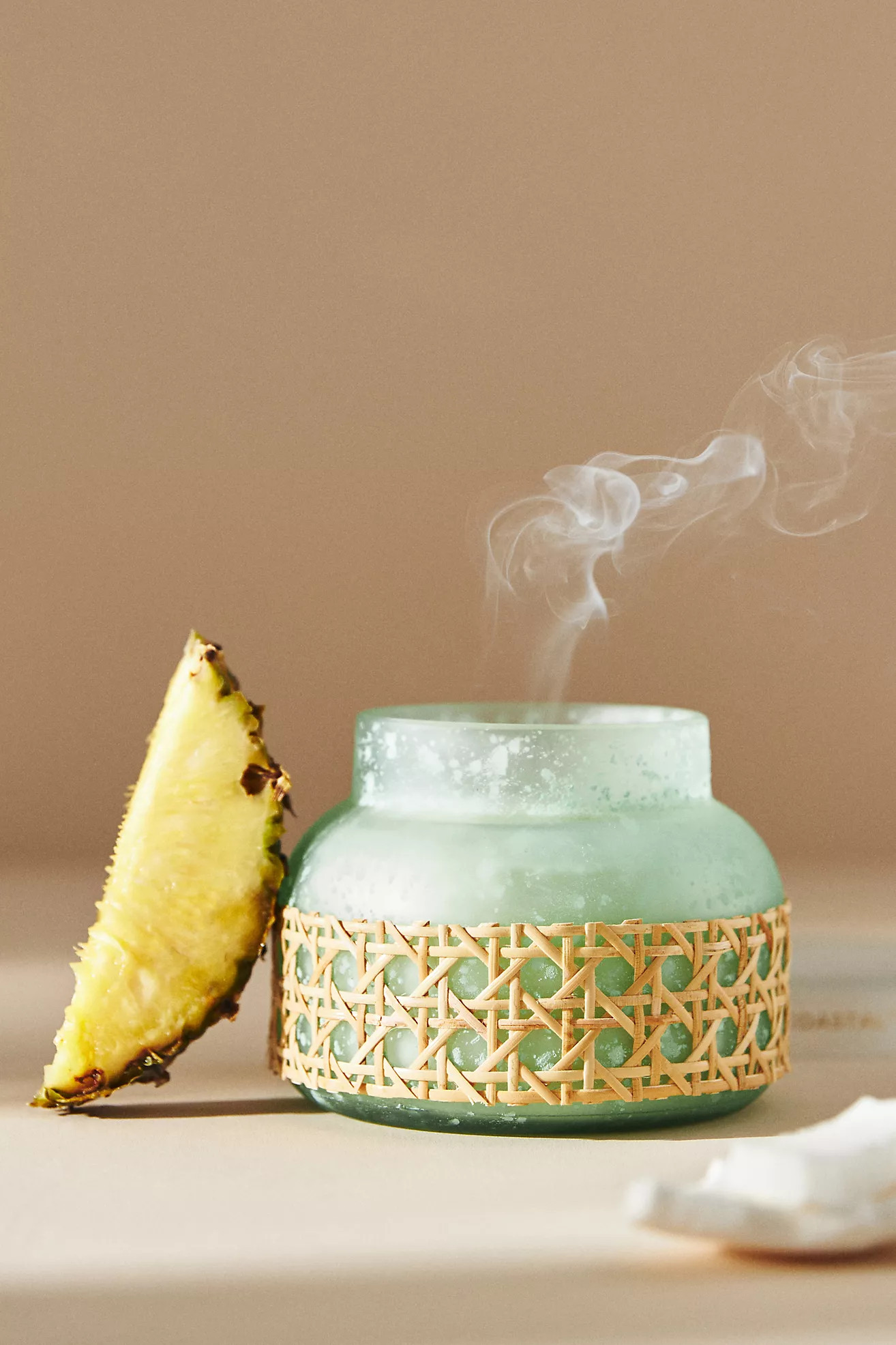 Capri Blue Rattan-Wrapped Glass Jar Candle | Anthropologie (US)