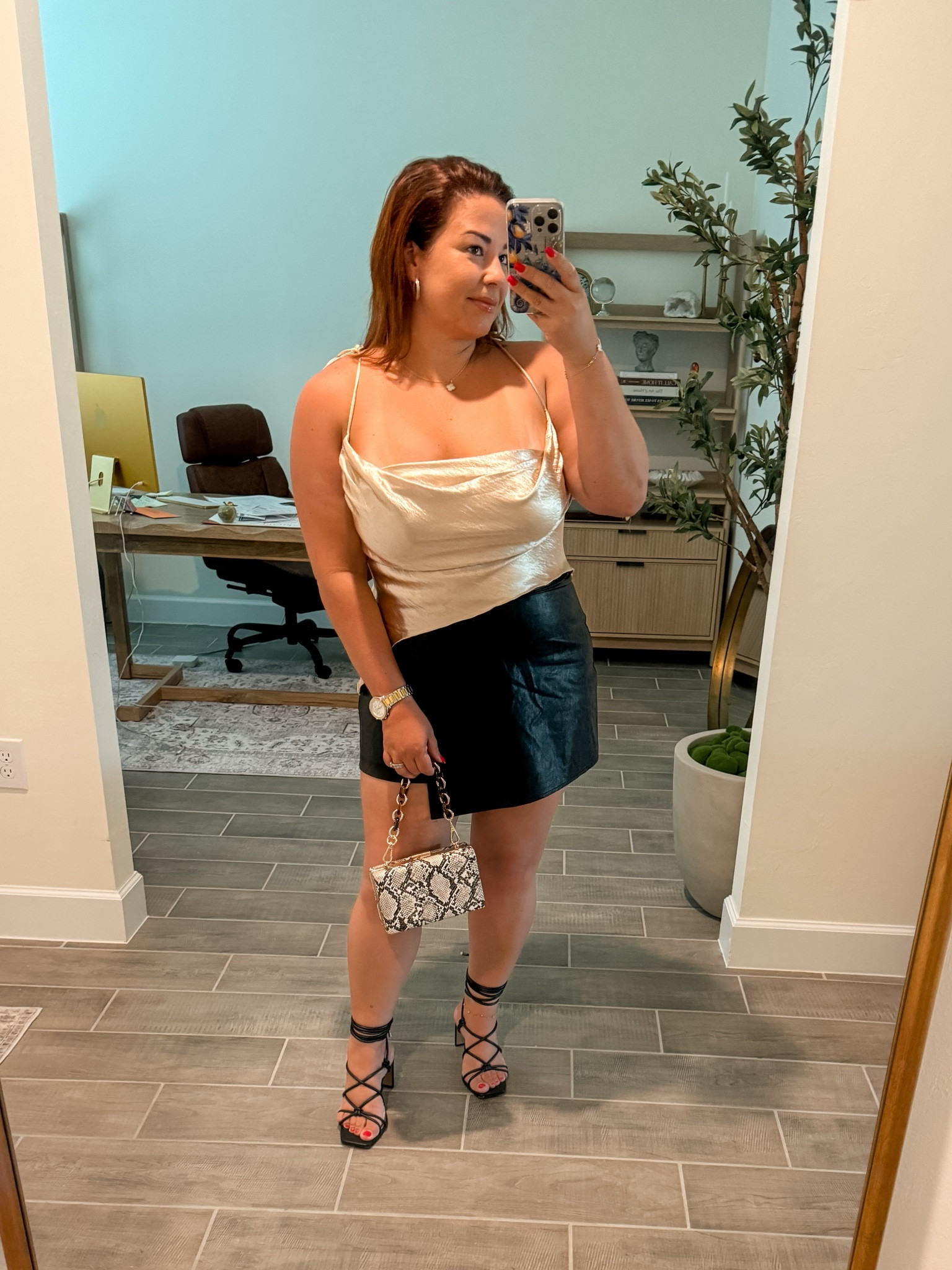 Date night outfit . Leather skort , strappy heels ! Silk gold top . Snake print bag . 

#LTKFindsUnder50 #LTKStyleTip #LTKMidsize