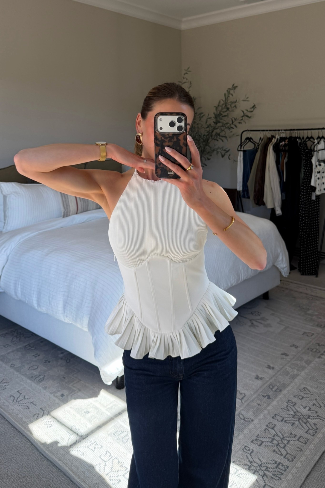 This structured white halter top is so flattering and fun! Wear it out on the town or pack it for your next vacation! Wearing size small.

#LTKootd #LTKSeasonal #LTKTravel
