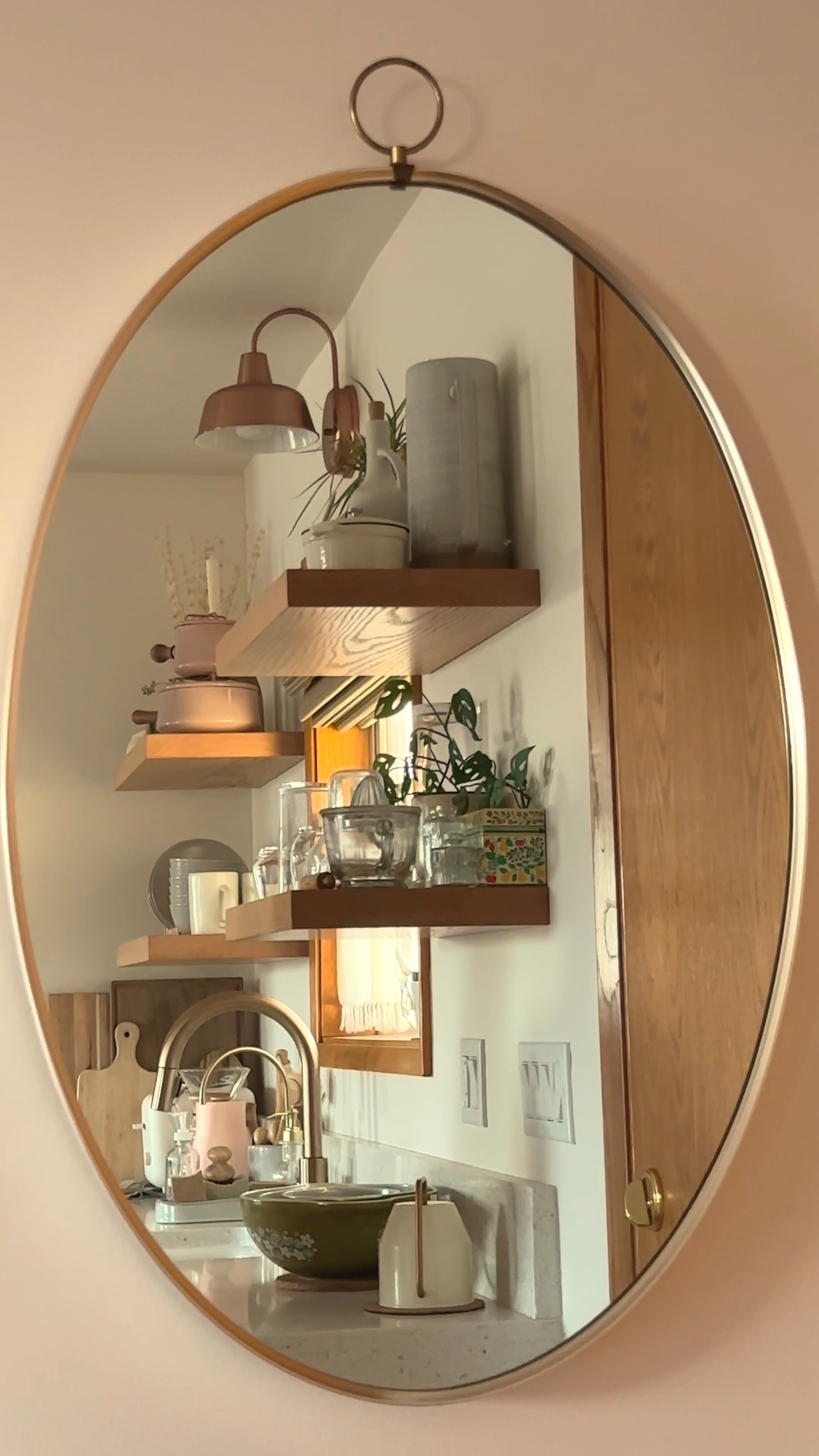 This vintage mirror was found at an estate sale, but I have put together a few of my favorite oval mirrors for sale right now, that could give you the same look and feel of ours. #mirror #walldecor #ovalmirror #kitcheninterior #kitchendecor #brass

#LTKhome