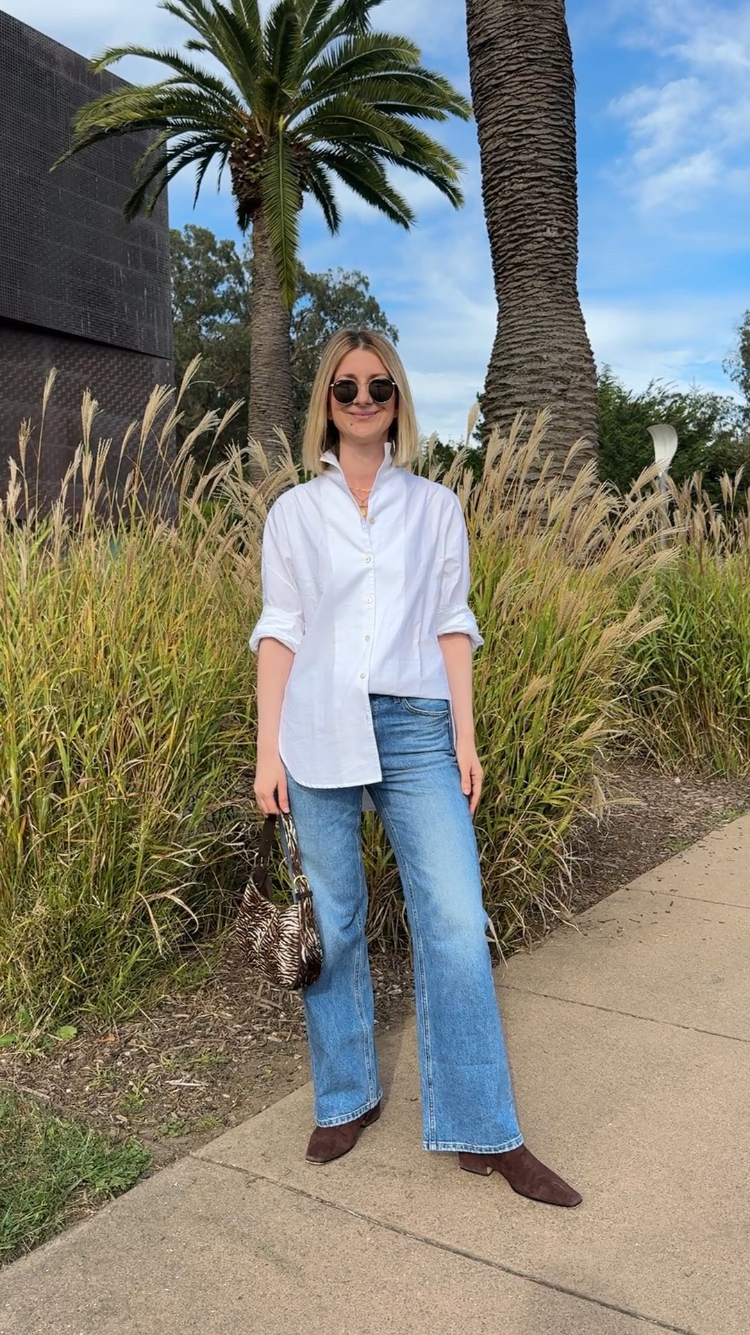 Super flattering and comfortable wide leg jeans paired with a chic crisp white button down shirt (with an unique collar design) and chocolate suede ankle booties ✨ Great pieces for building a capsule wardrobe and/or effortless everyday looks 

#LTKStyleTip