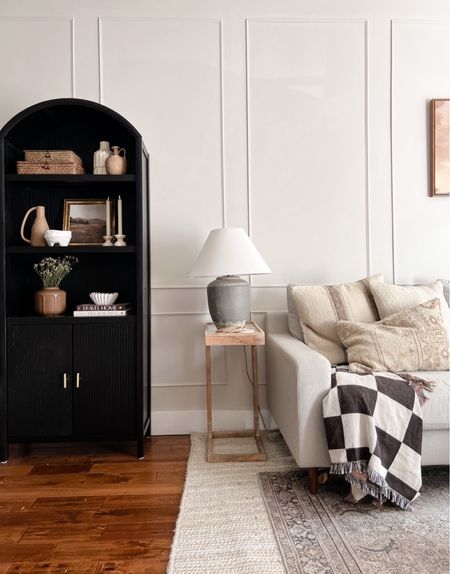 Every room need a pop of black in my opinion! I love this black arched bookshelf and it was such a great price. Living room design, living room decor, home decor 

#LTKhome #LTKFind