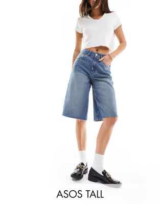 ASOS DESIGN Tall baggy longline denim jorts in midwash blue | ASOS (Global)