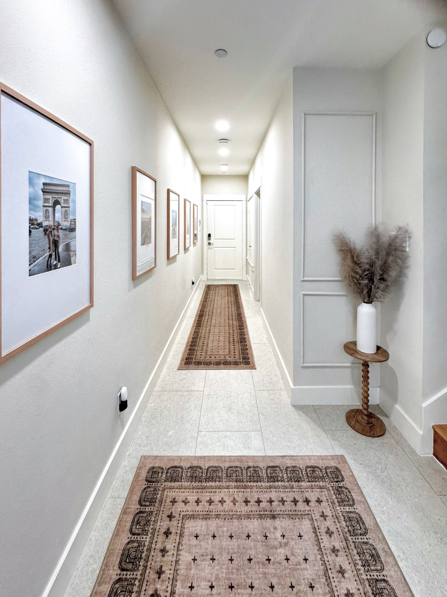 Neutral hallway goals 🤍 Layered runners, framed travel prints & a touch of pampas grass bring warmth and style to this bright entryway. 

#LTKHome