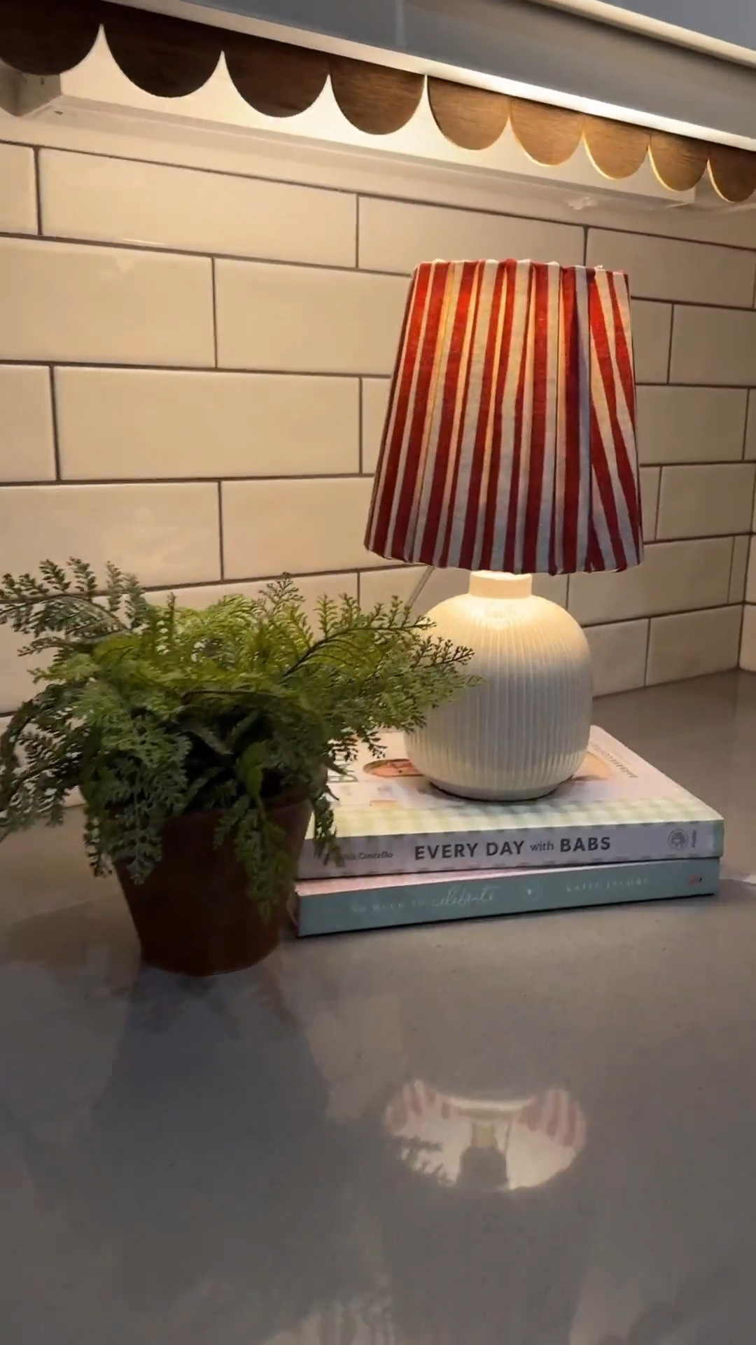 Hi! I’ve decided to start a new series titled “Diary of a recovering beige addict” 🤣 Because, it’s true! This sweet little home has forced me to pull my creativity from hiding and this time around I’m having FUN with patterns and color! 

Starting with covering this sweet little beige lamp shade with fun fabric! Thank goodness I’m not a perfectionist, because if so, these stripes would have Driven me crazy. After finding the correct adhesive and returning the iron on, I used a combination of hot glue and permanent adhesive. 

I definitely questioned myself and…yes, it would have been easier to just purchase a patterned lamp shade but this was fun and I got to watch a rom-com in the process, so overall it was a win! 

I did round up a few fun lamp shades, if you want to add some layers to your home (without the DIY!) just comment “LINK” & I’ll send them and my kitchen links to you! 

#springstyle 

#LTKHome