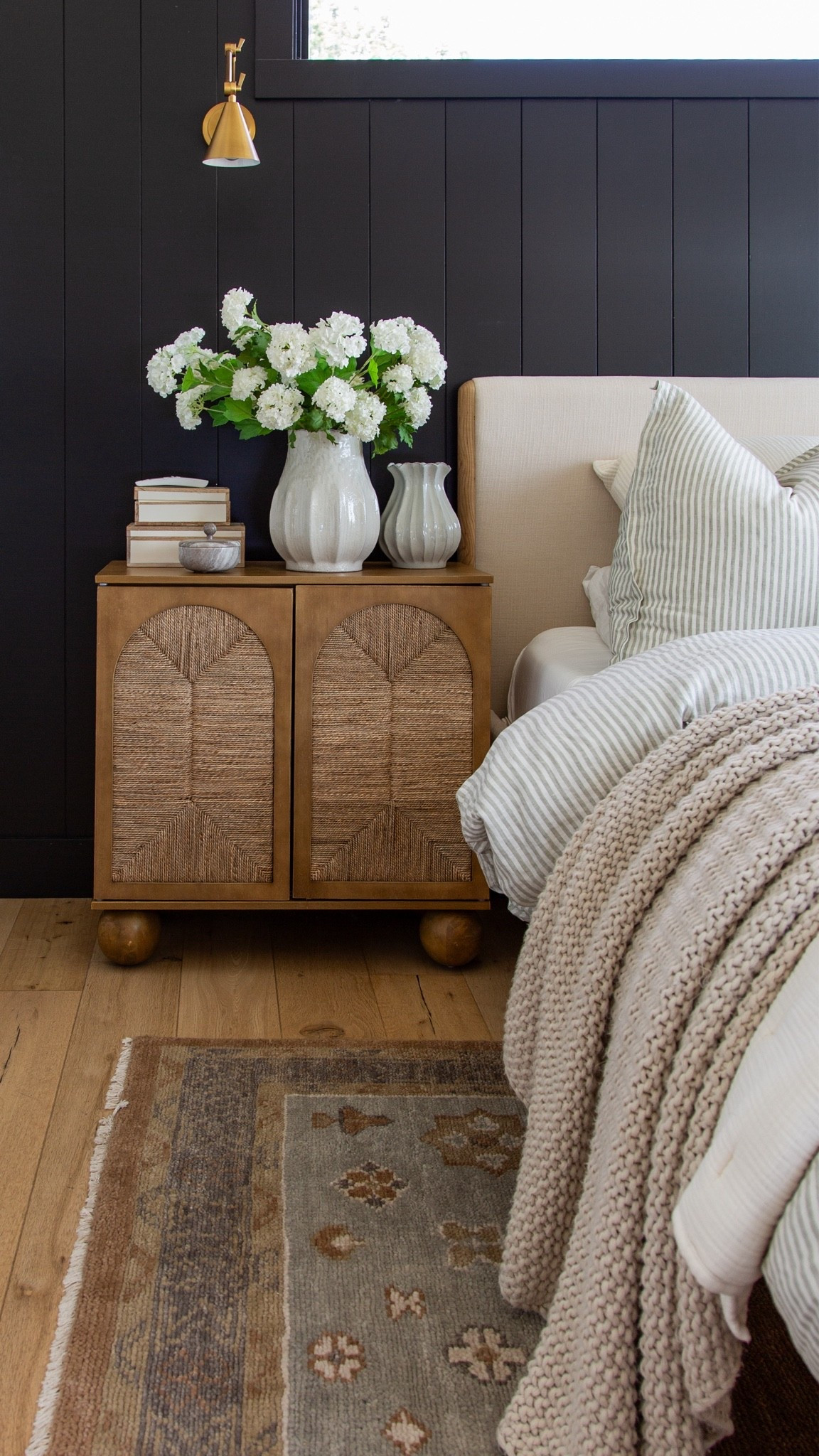 Run, don’t walk because these Nathan James nightstands are 30% off right now 🤍 I love the warm wood tone, woven texture detailing, and rounded feet… they add so much character to our bedroom while still feeling clean and modern. Such a good designer-inspired find for a modern organic bedroom, especially paired with neutral bedding, brass sconces, and vintage-style rugs.

Nathan James nightstands, woven nightstand, modern organic bedroom, bedroom furniture, neutral bedroom decor, designer look for less, wood nightstand, cozy bedroom styling, modern cottage bedroom, affordable home decor, woven furniture, warm wood furniture, bedroom inspiration, brass sconces, organic modern home decor